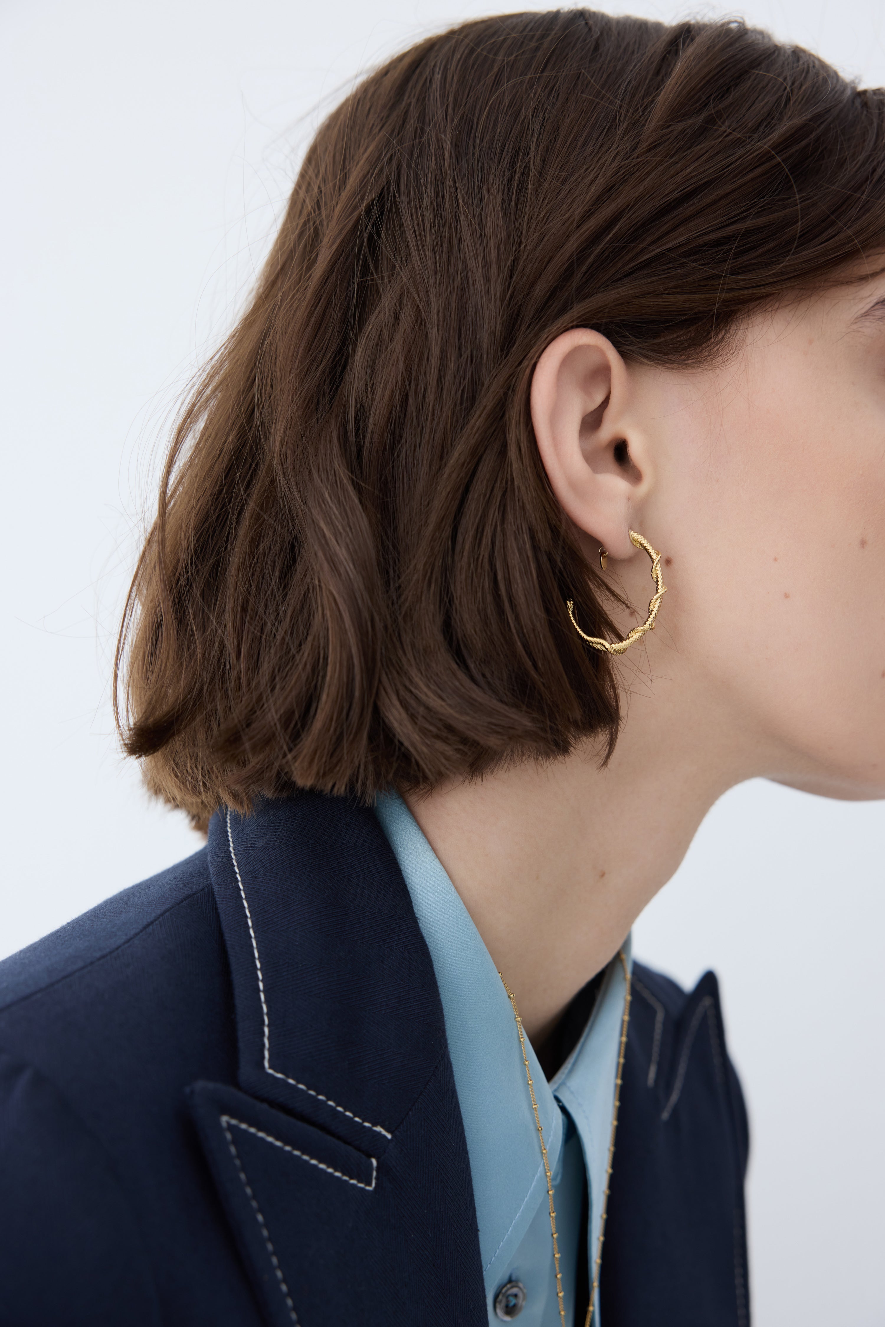 Gold snake post hoop earrings