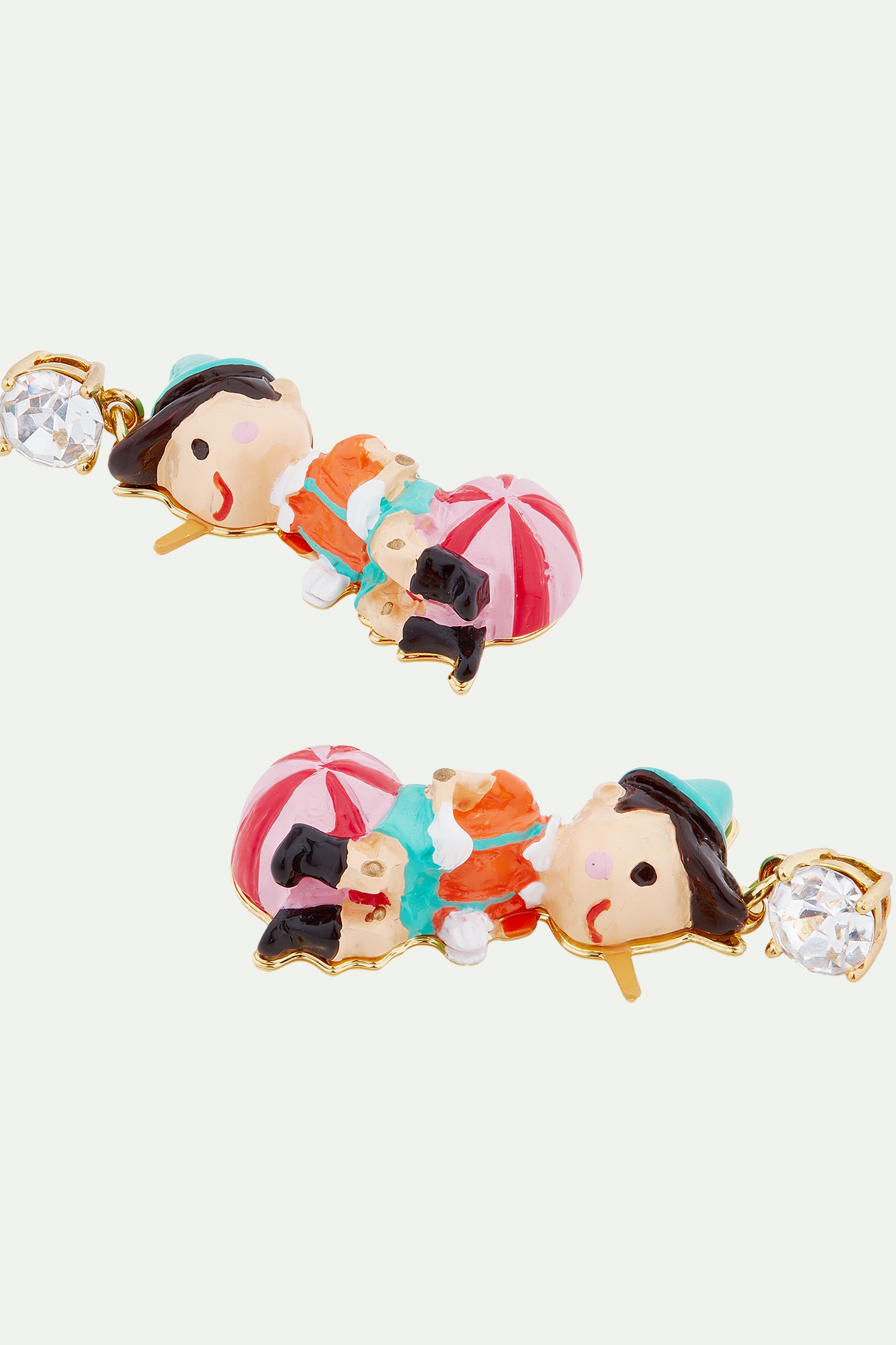 Pinocchio on his ball clip-on earrings
