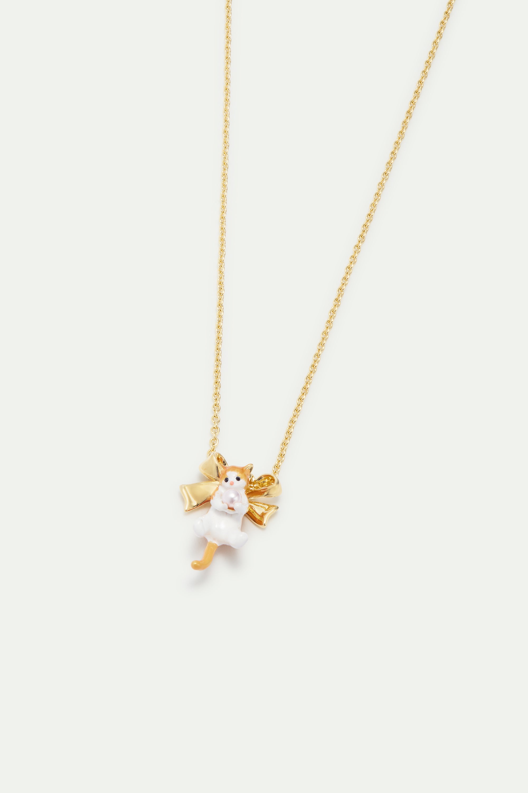 Orange tabby kitten and golden bow necklace