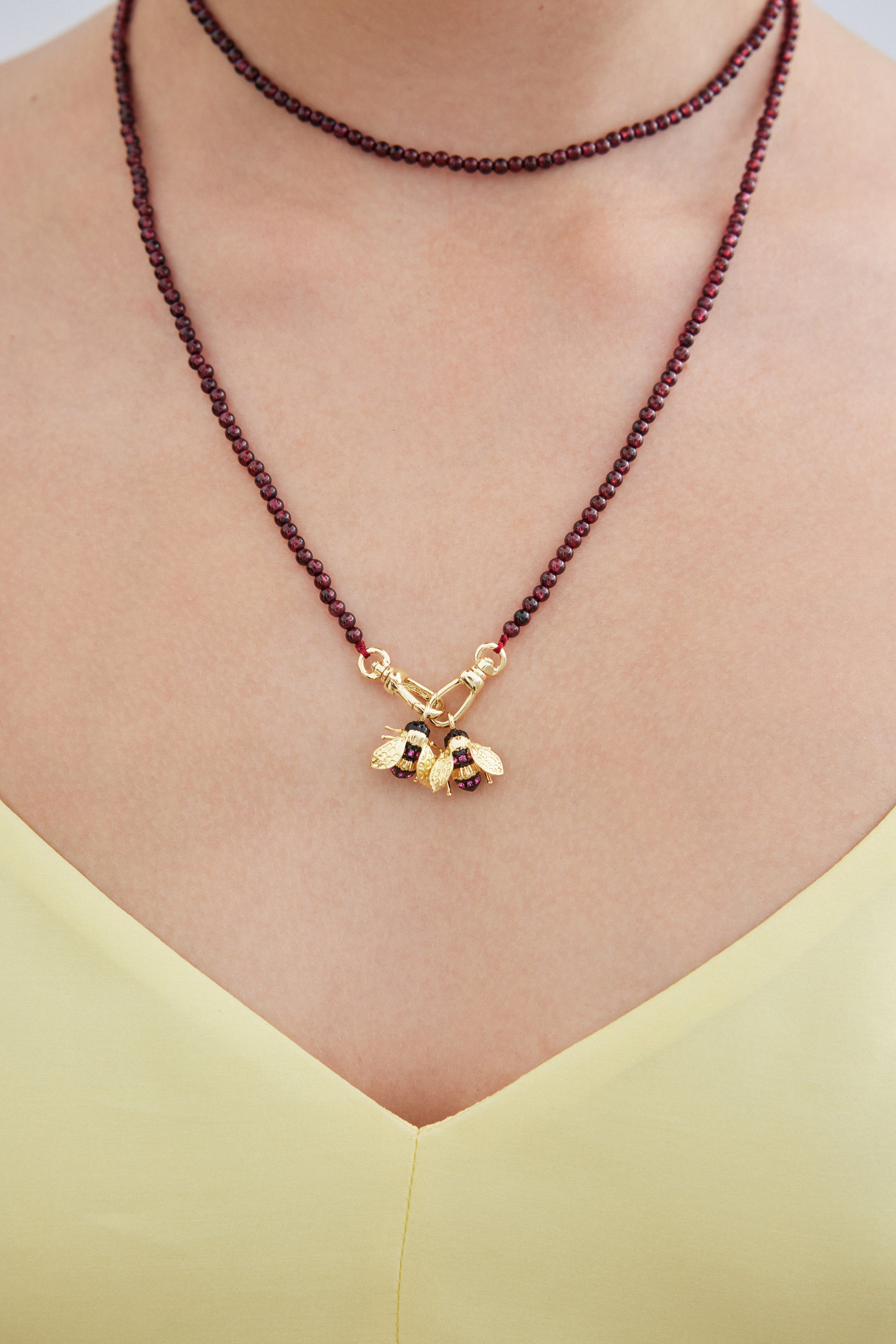 Necklace with garnet beads and gold bees