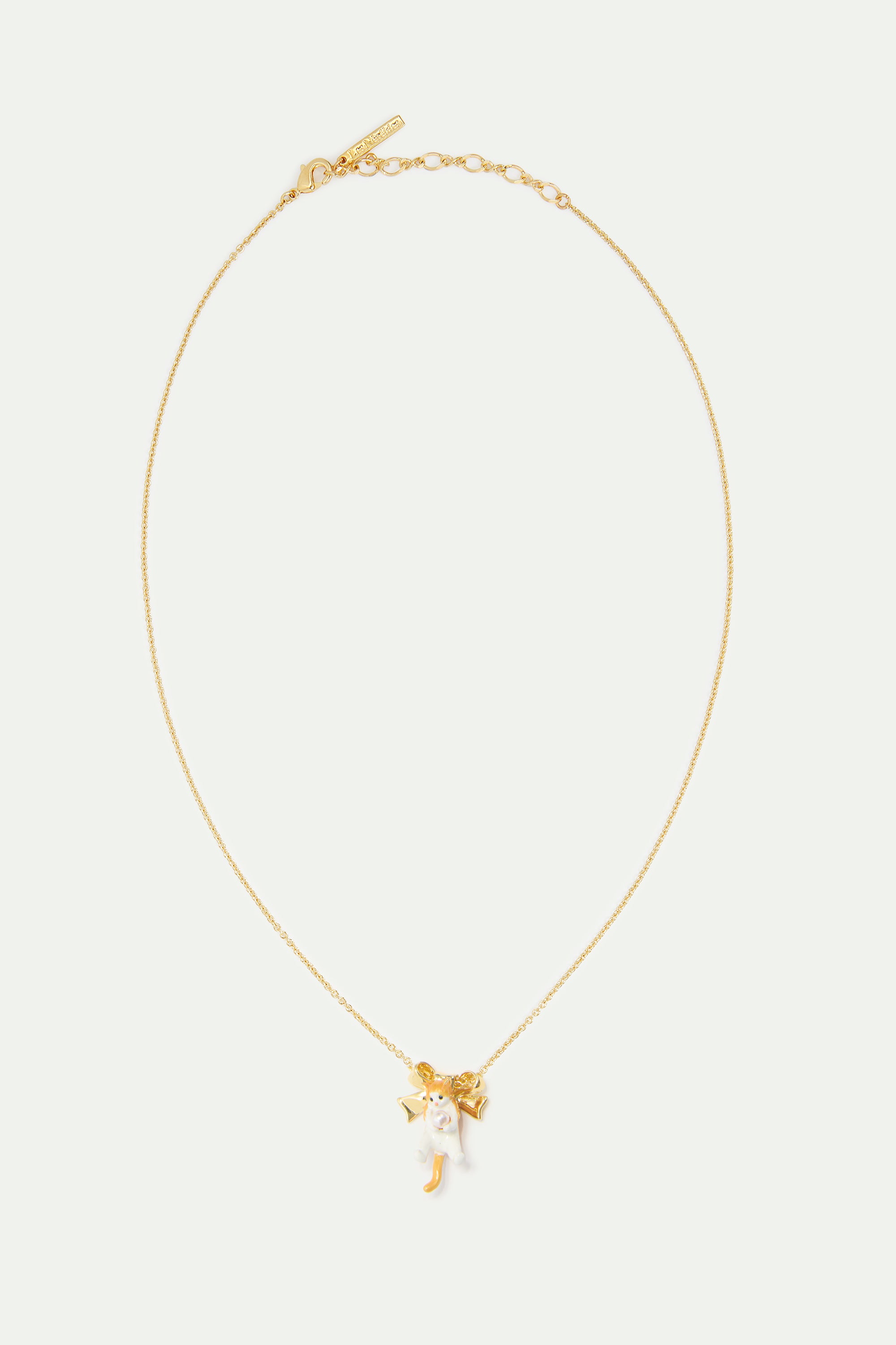 Orange tabby kitten and golden bow necklace