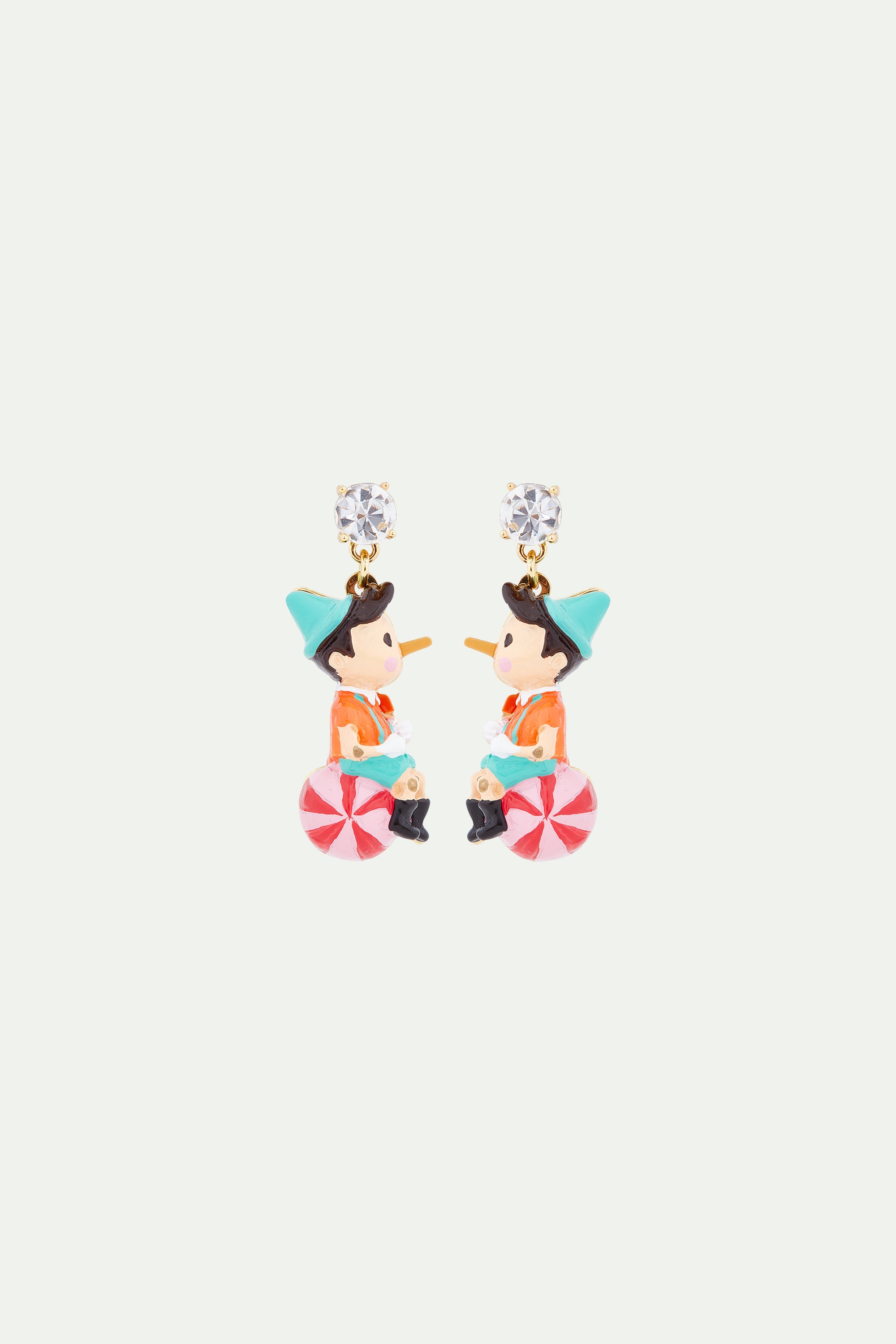 Pinocchio on his ball clip-on earrings