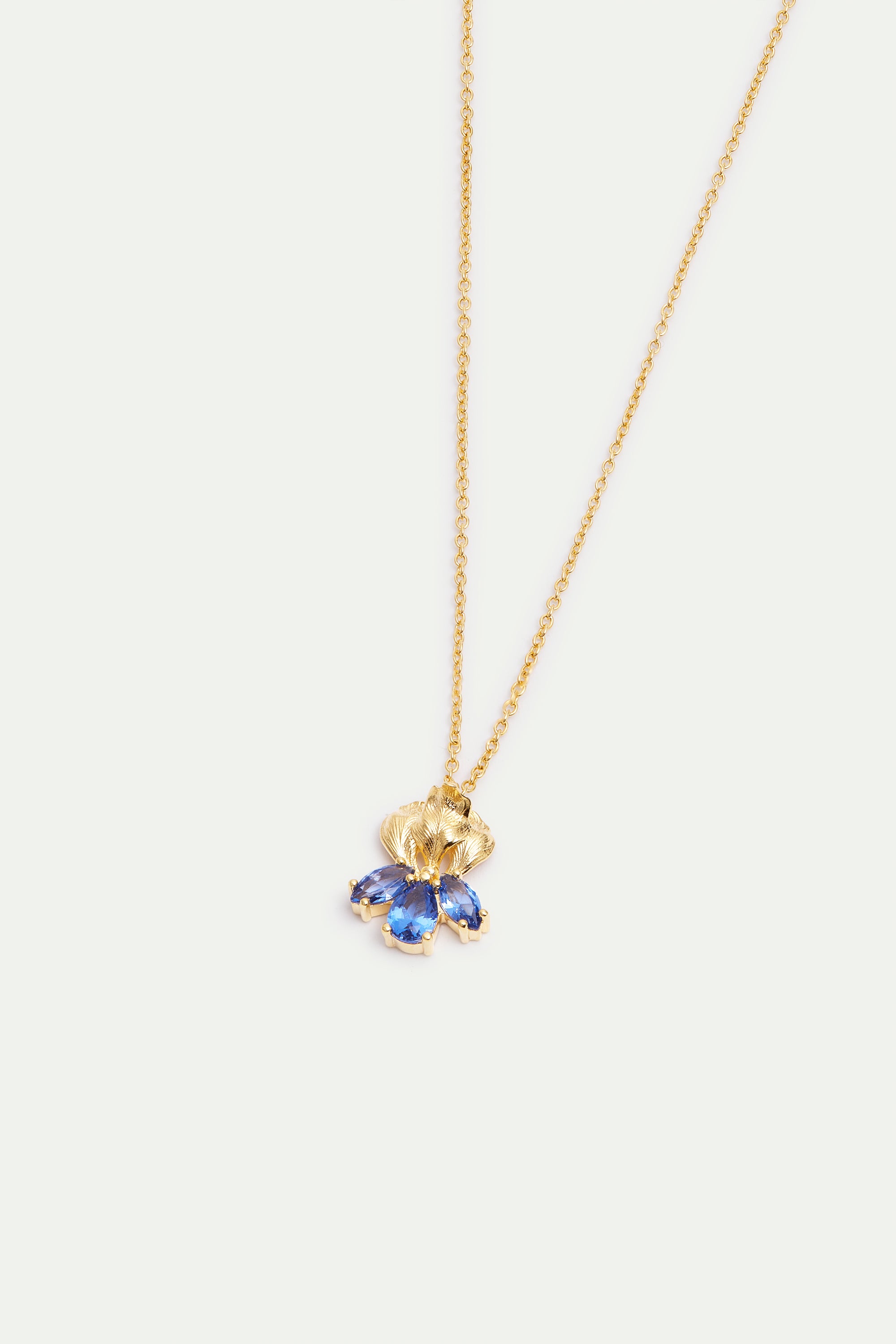 Gold iris flower and blue stone pendant necklace