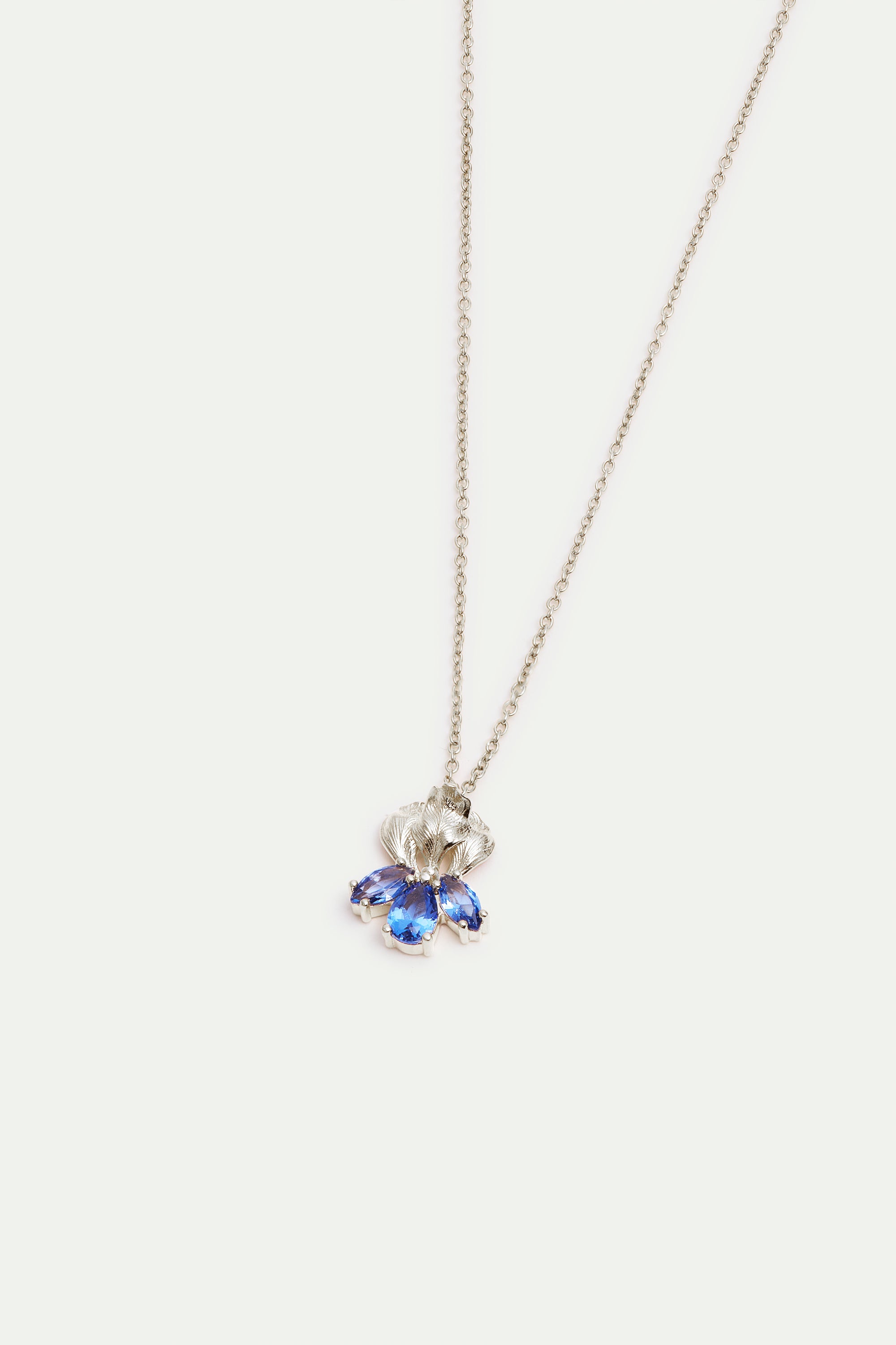 Silver iris flower and blue stone pendant necklace