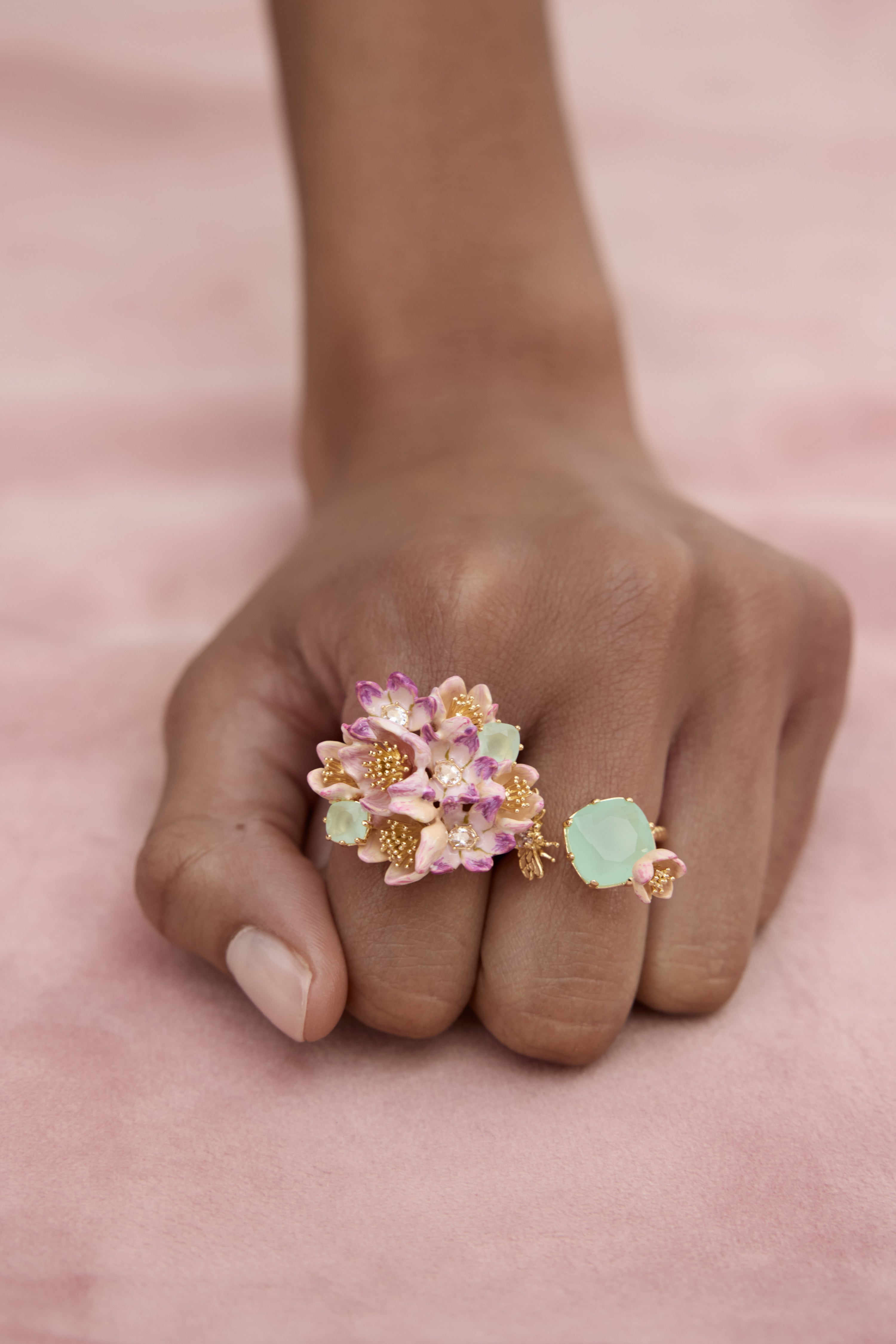 Bouquet of pink hellebores and green stone ring