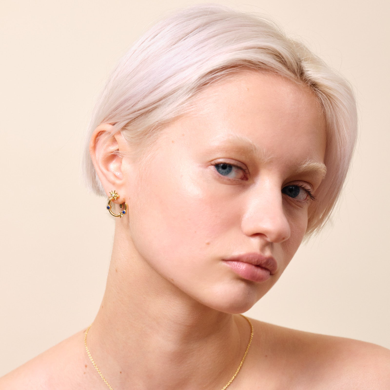 Gold stars and midnight blue stone post hoop earrings