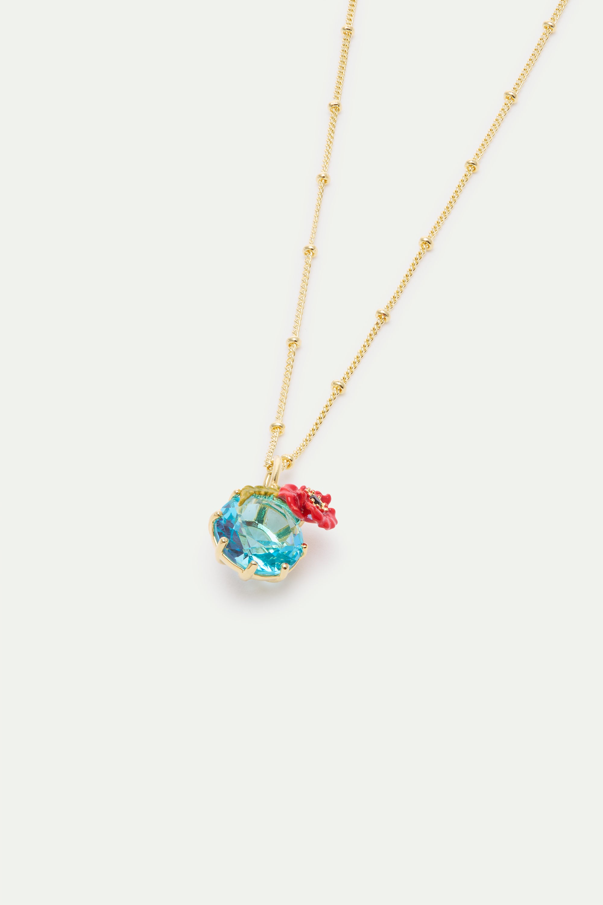 Pendant necklace with round blue stone and poppie
