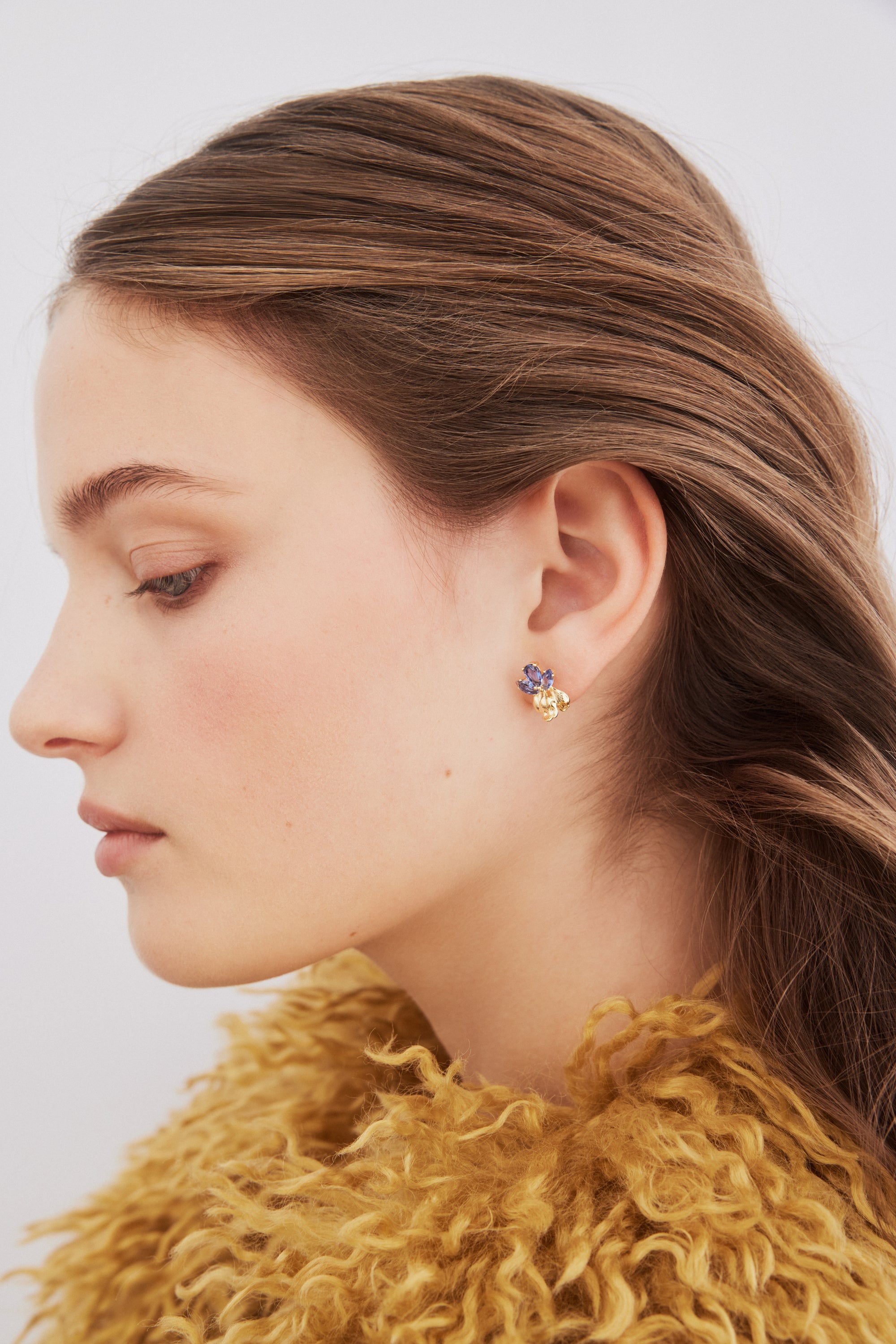 Gold iris flower and blue stone post earrings