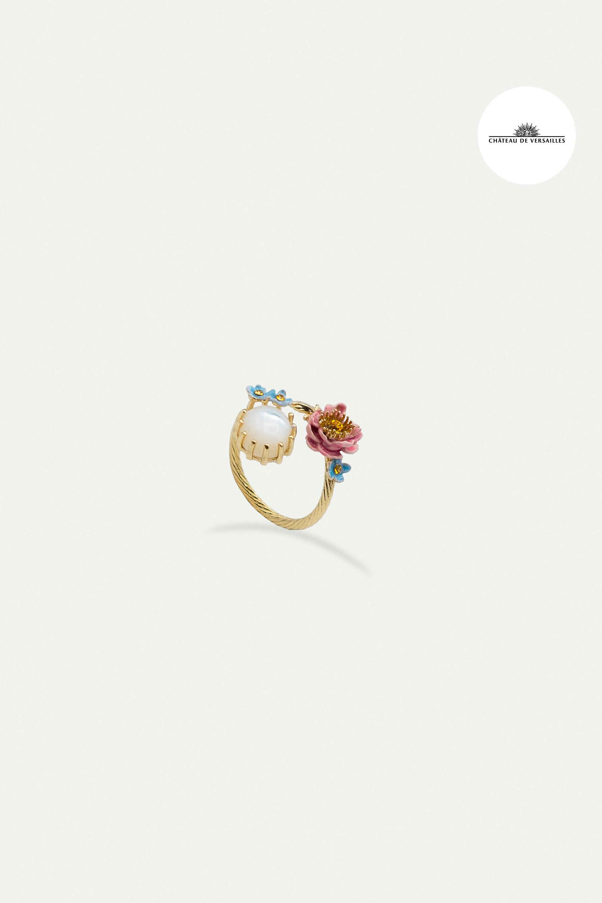 Adjustable ring with pink and blue flowers and round mother of pearl stone