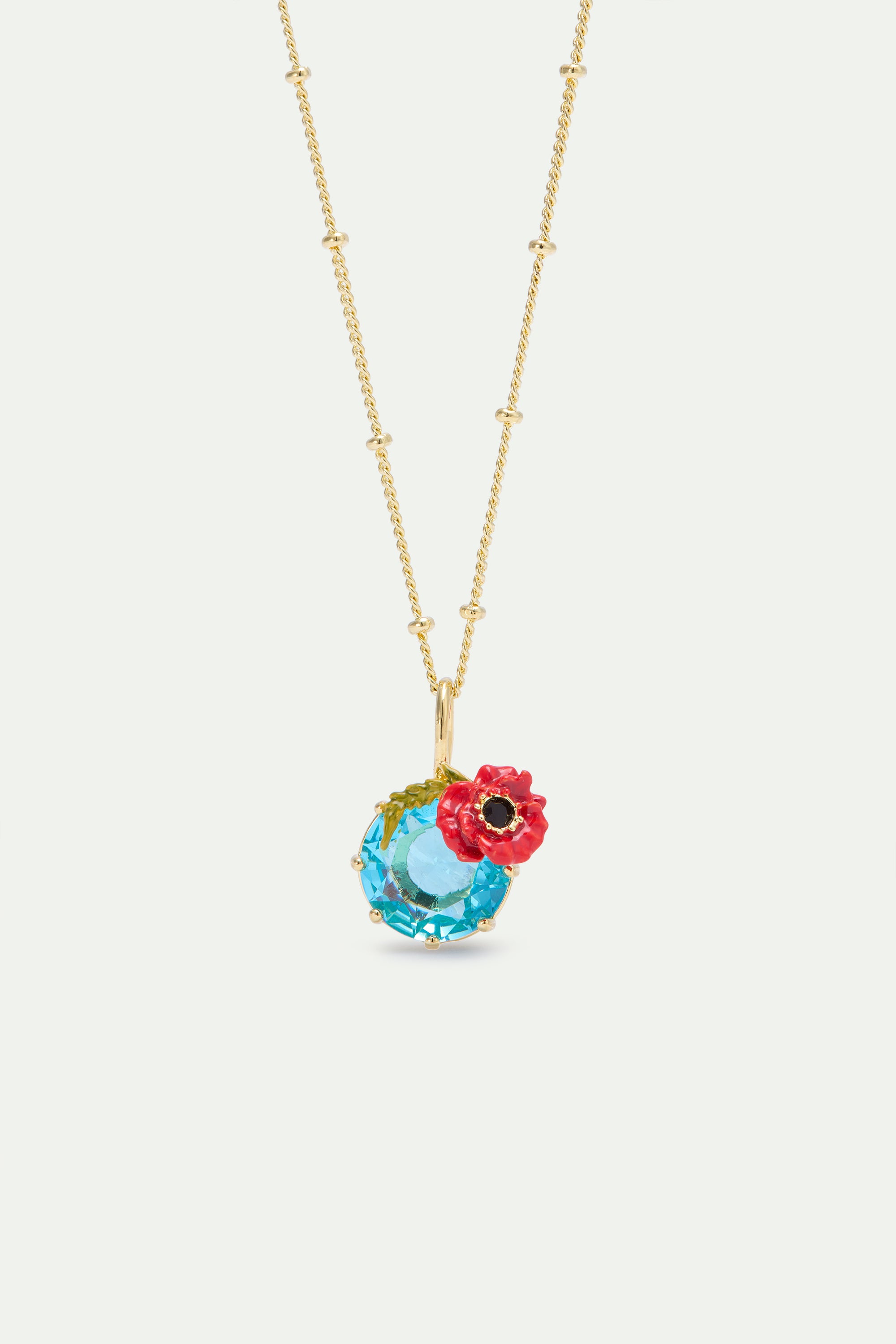 Pendant necklace with round blue stone and poppie