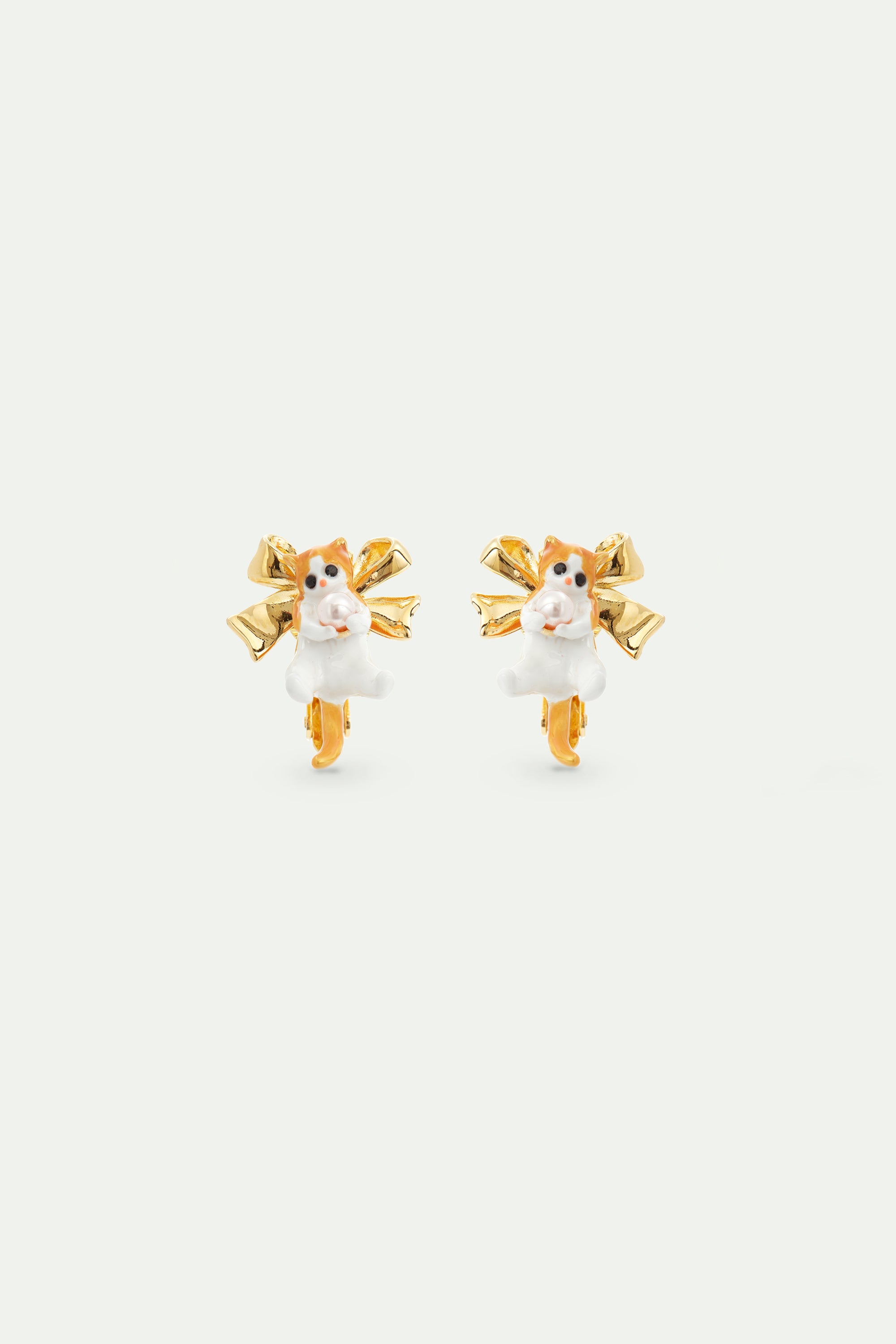 Orange tabby kitten and golden bow earrings