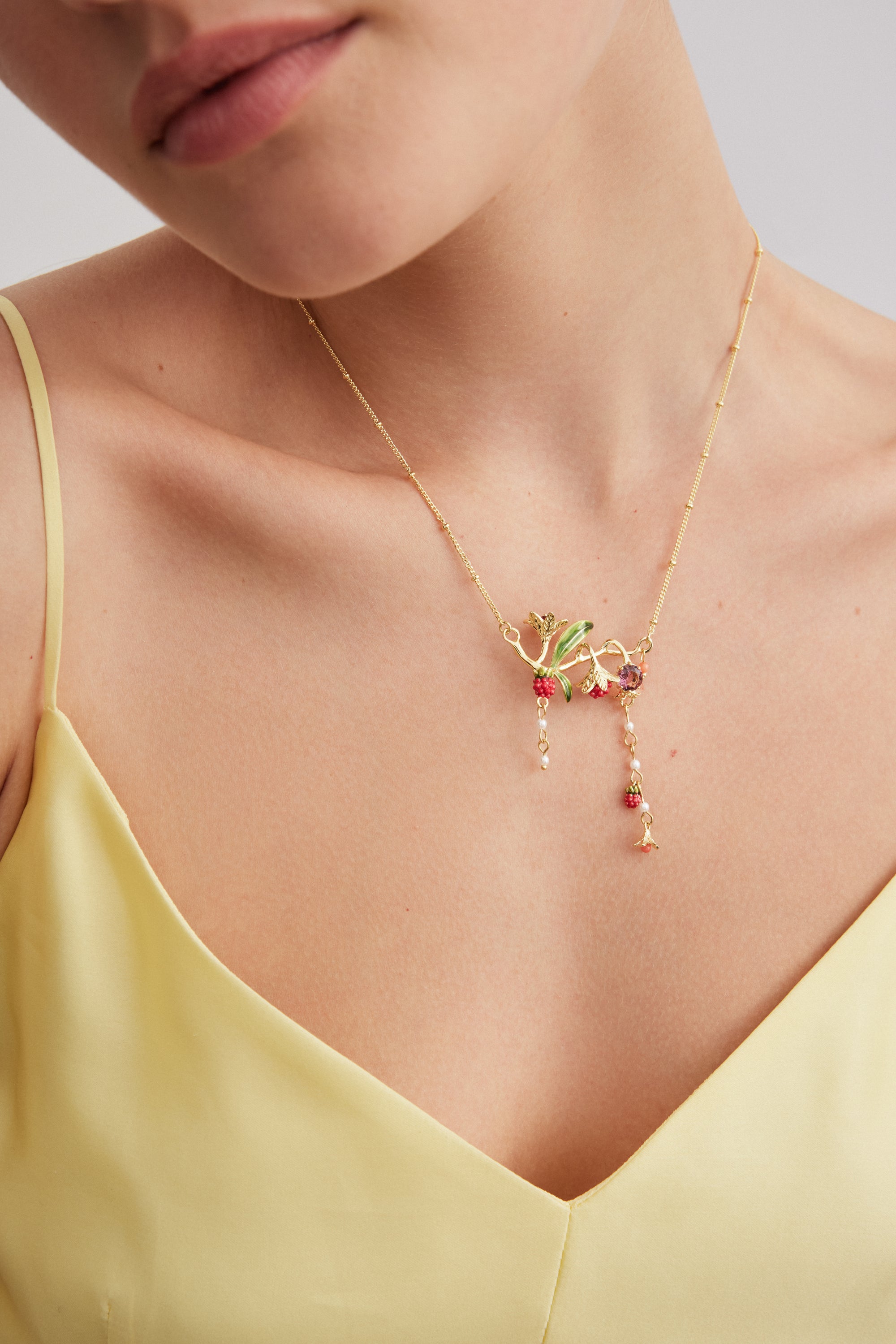 Statement necklace with flowers, raspberries, pink stone and pearls