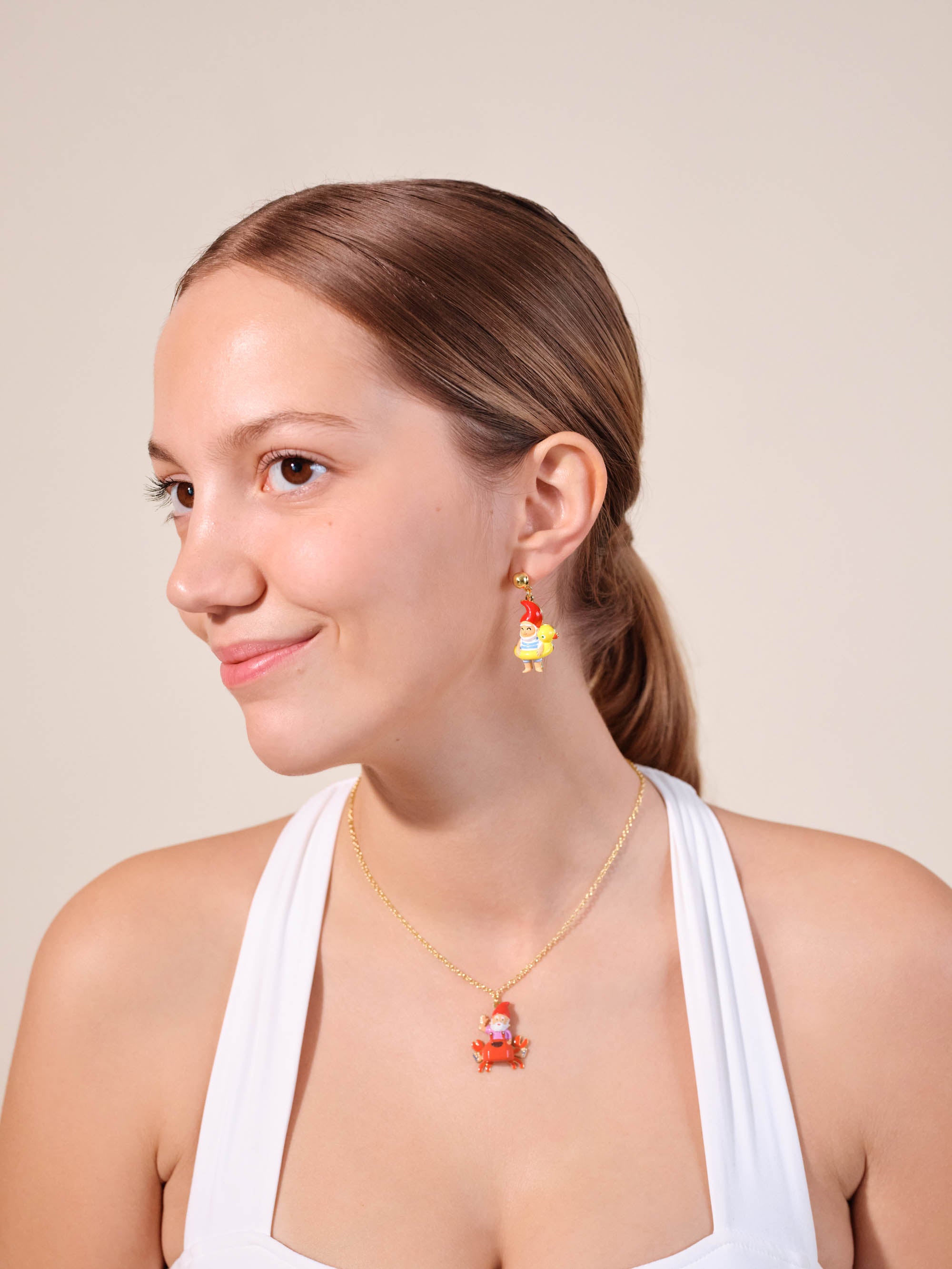 Garden gnome and inflatable duck ring earrings