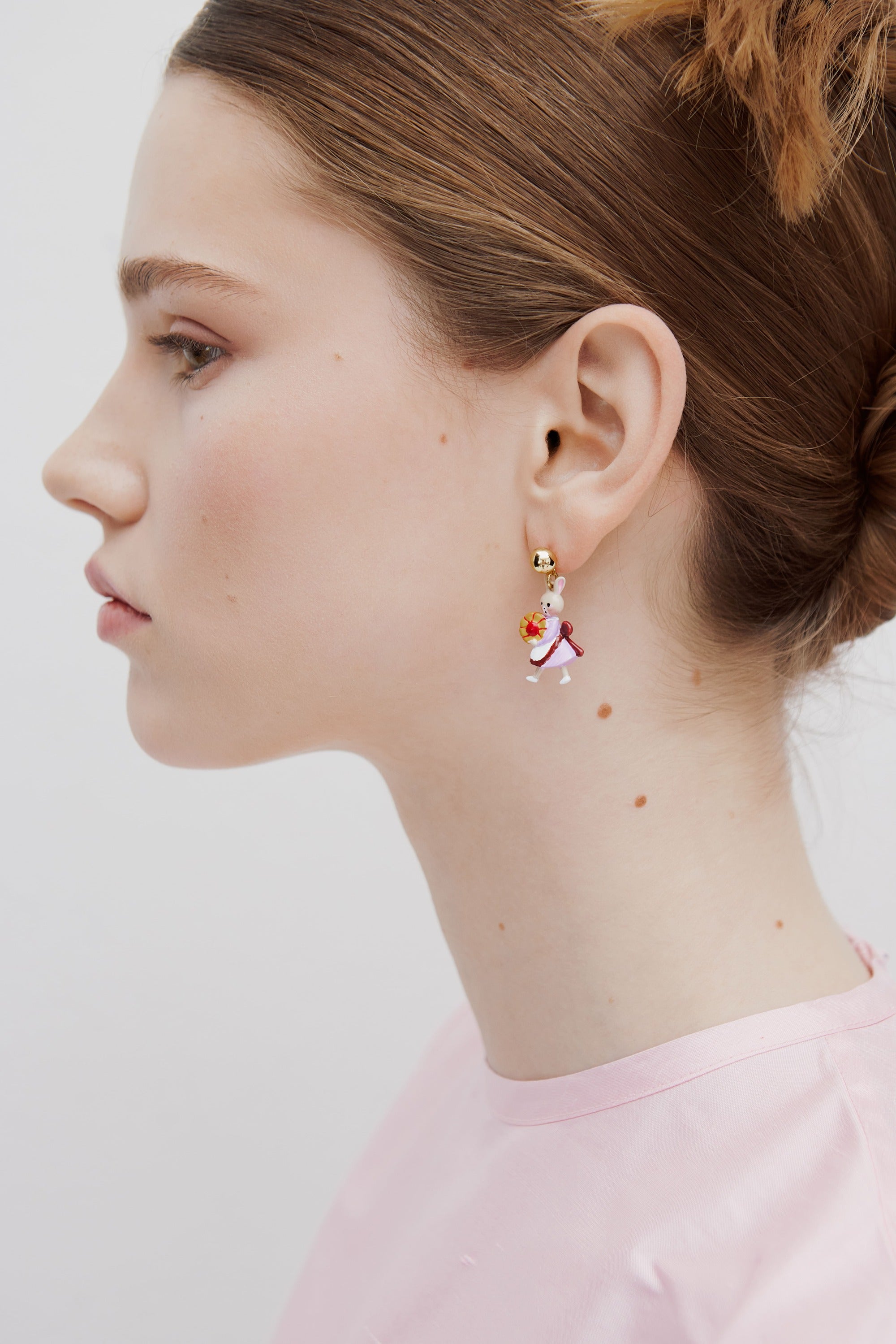 Asymmetrical dangle earrings with rabbit Hansel and Gretel.