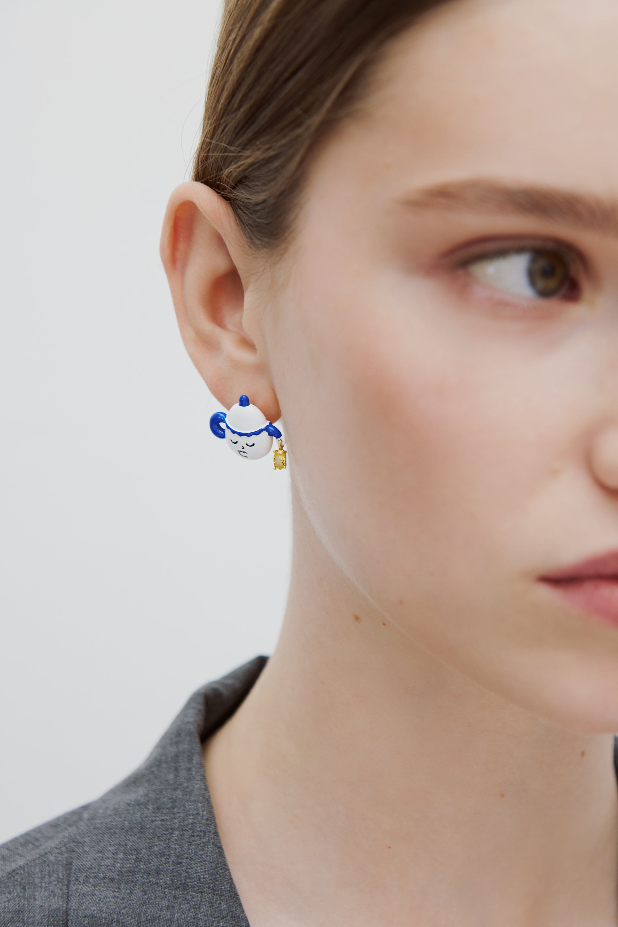 Asymmetric post earrings with blue and white teapot and little yellow stone