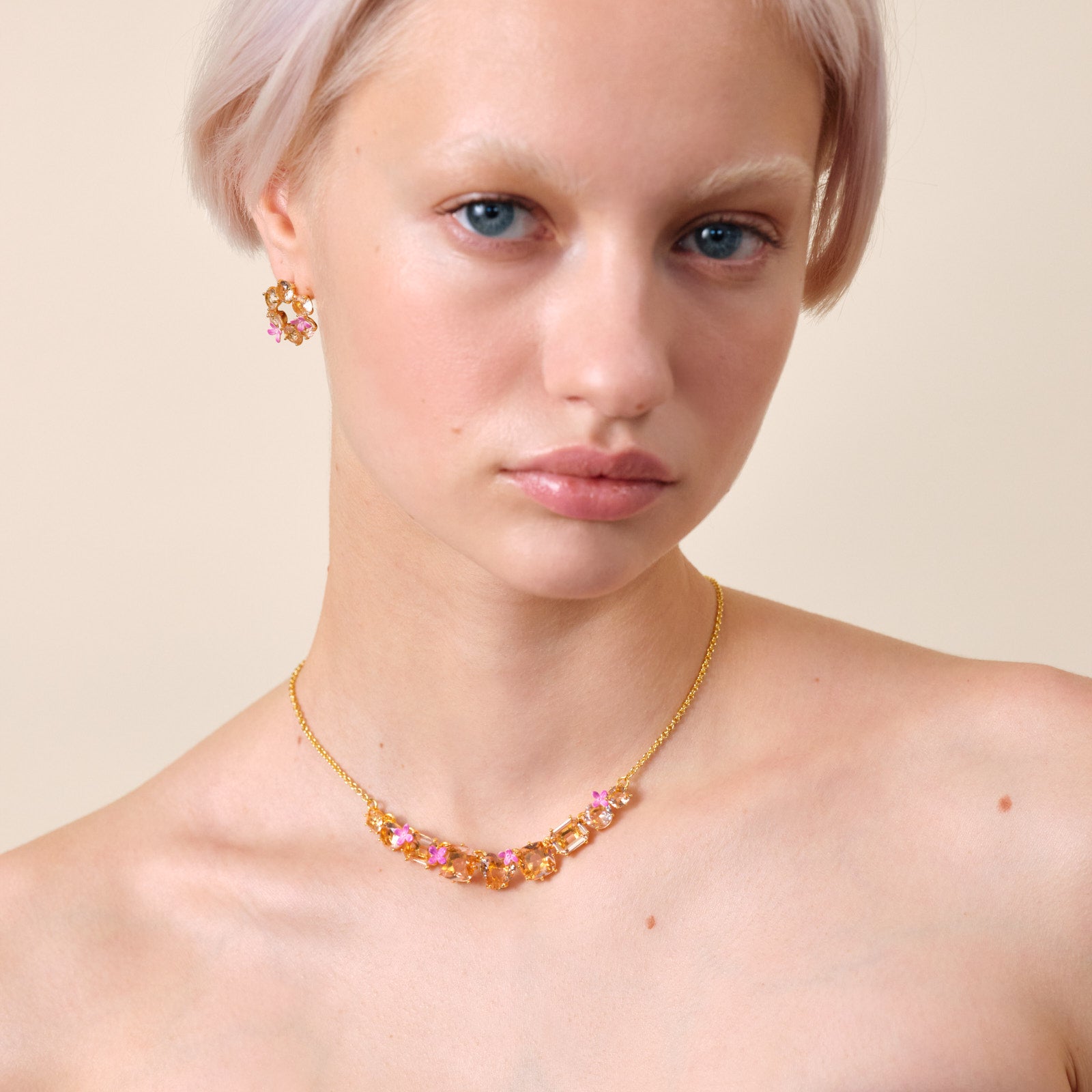 Apricot pink diamantine flower and 9 stone fine necklace
