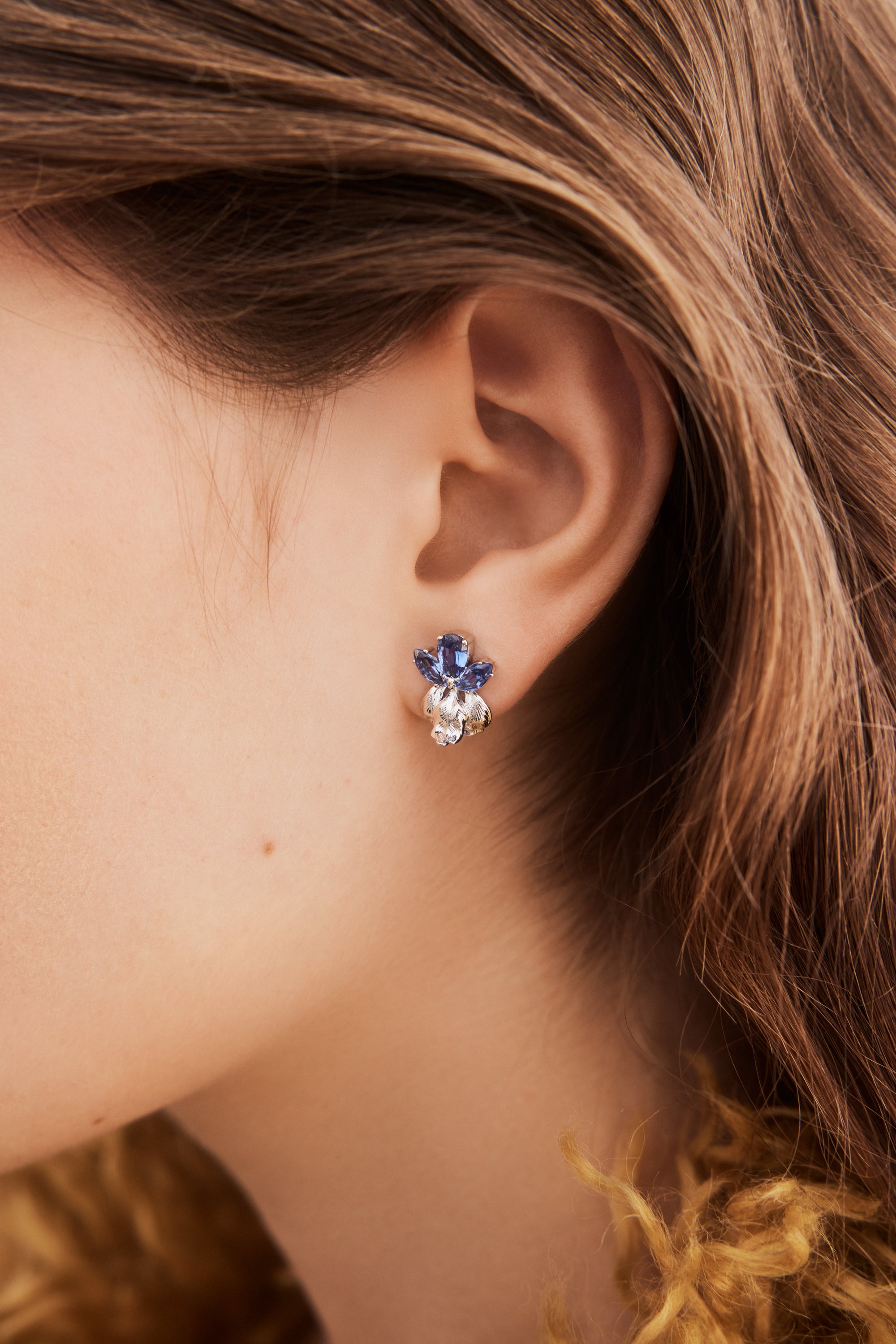 Silver iris flower and blue stone post earrings