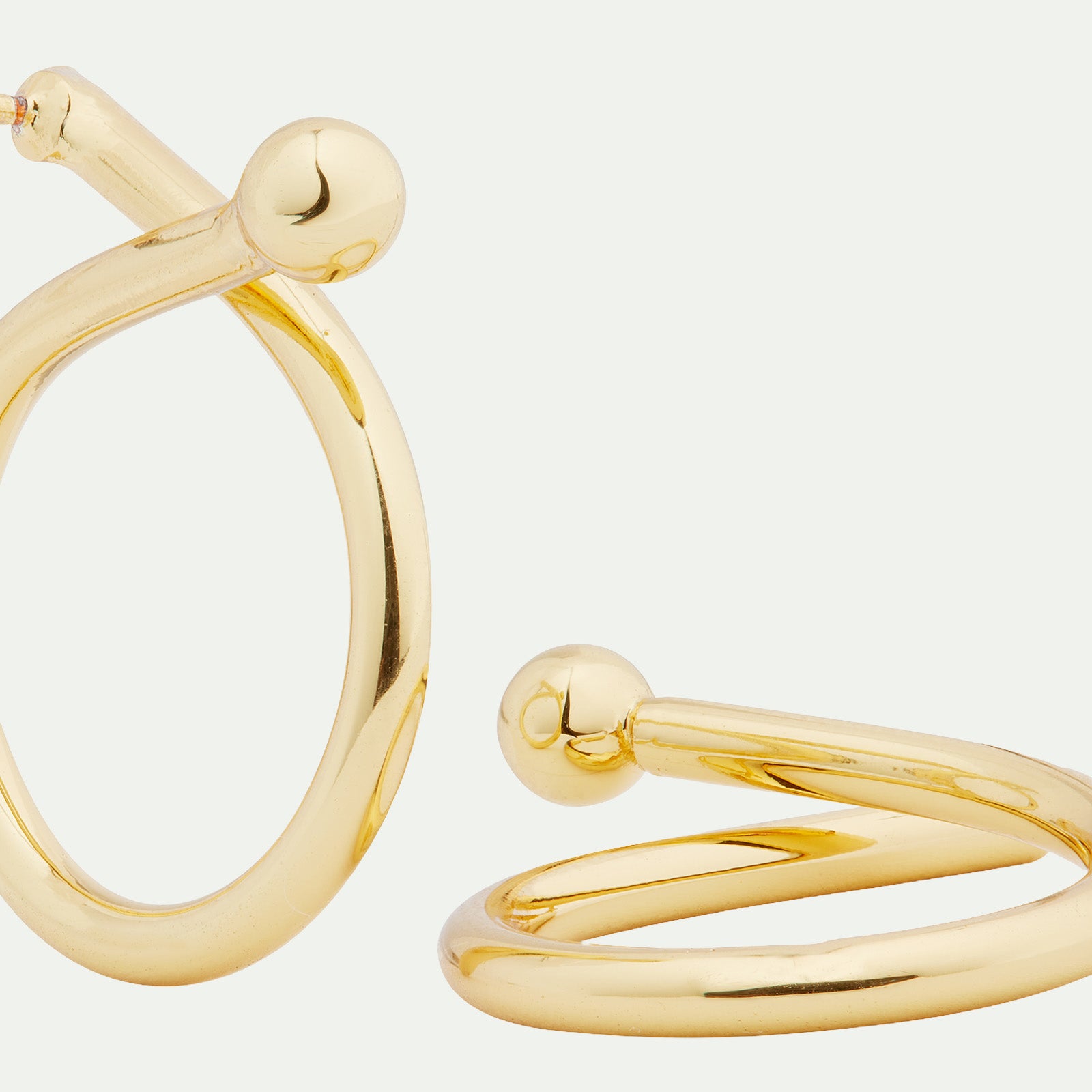 Criss-cross charm hoop earring