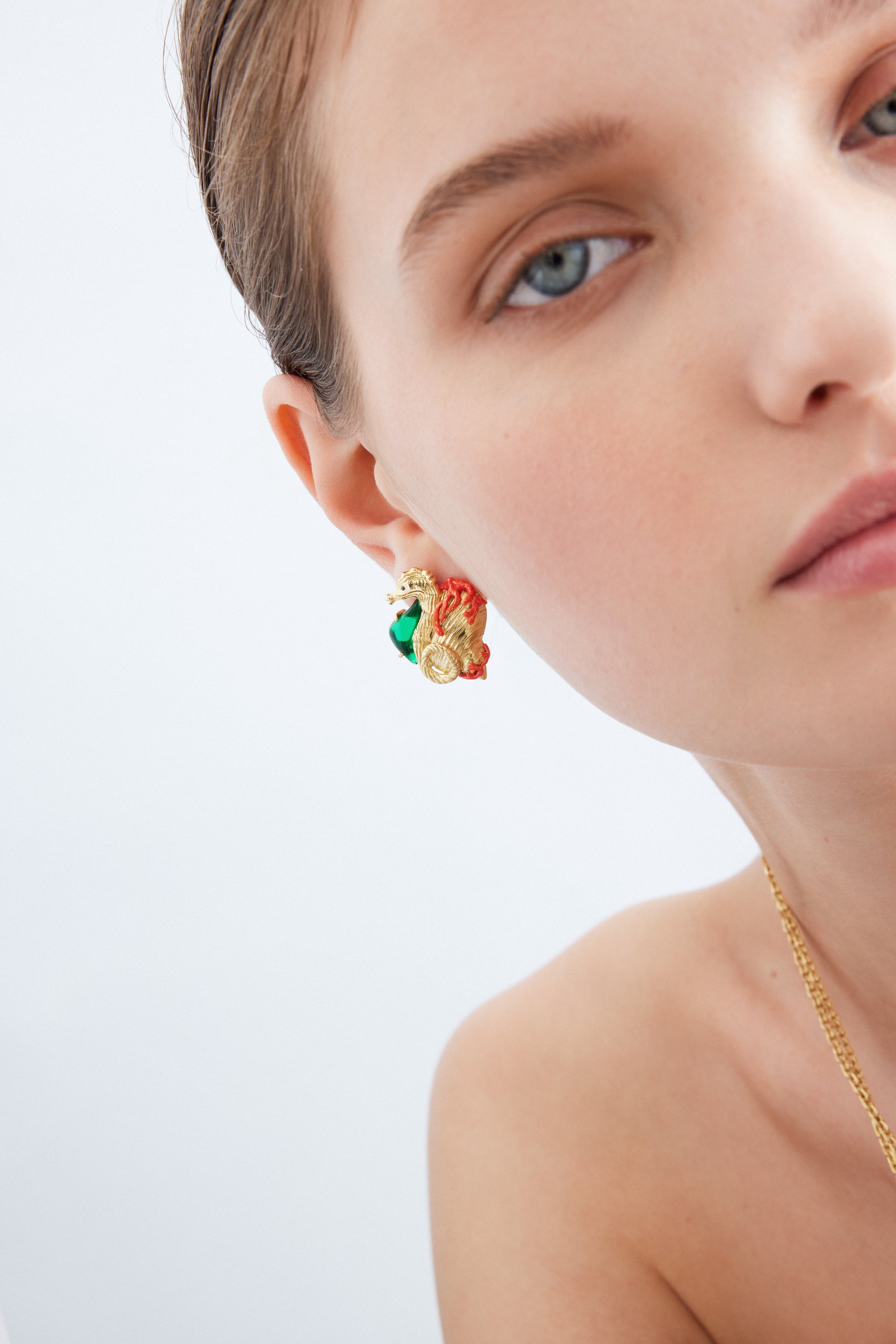 Golden seahorse and green stone earrings