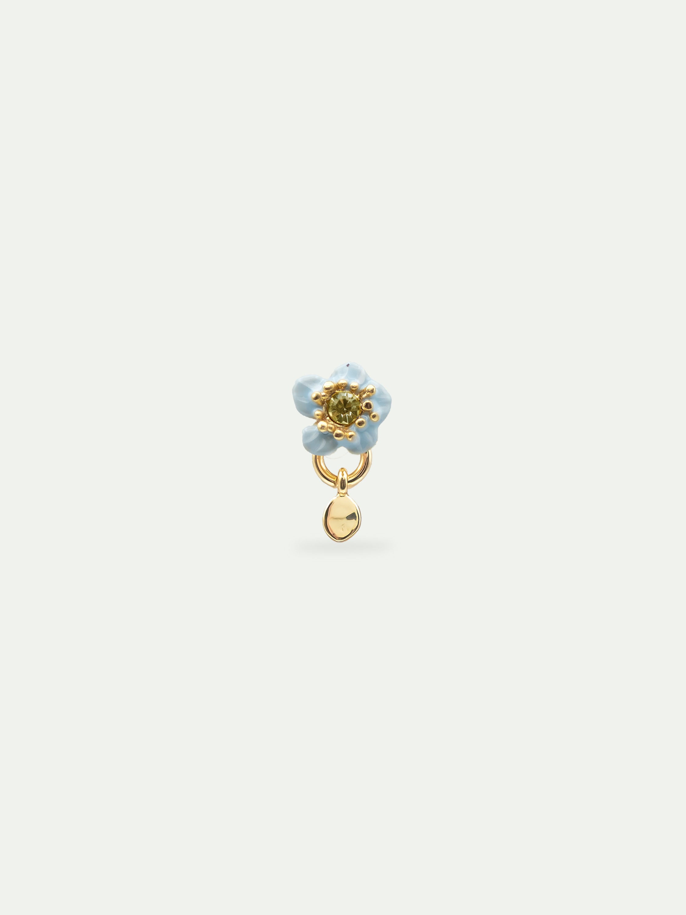 Single earring with a blue flower and a faceted stone