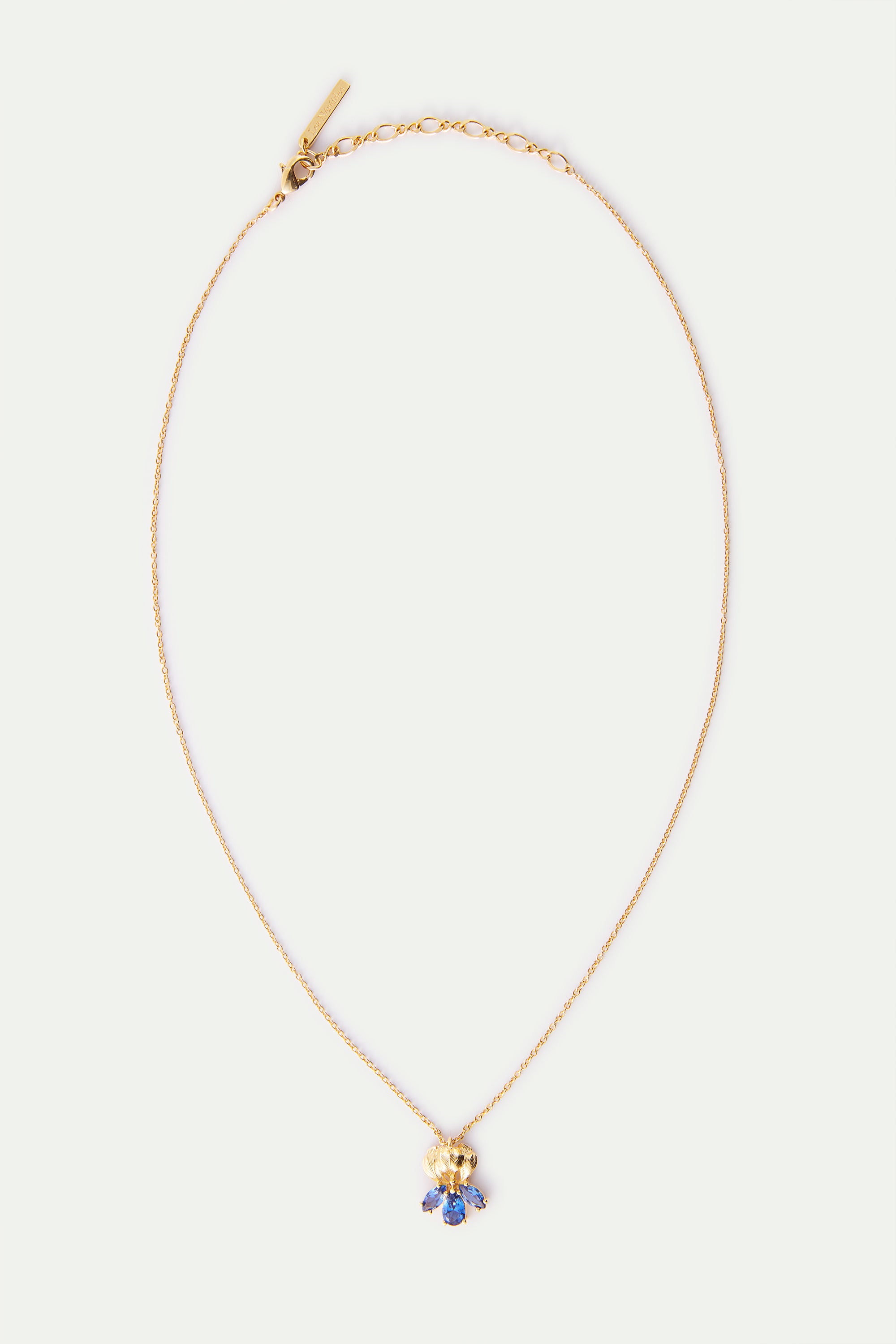Gold iris flower and blue stone pendant necklace