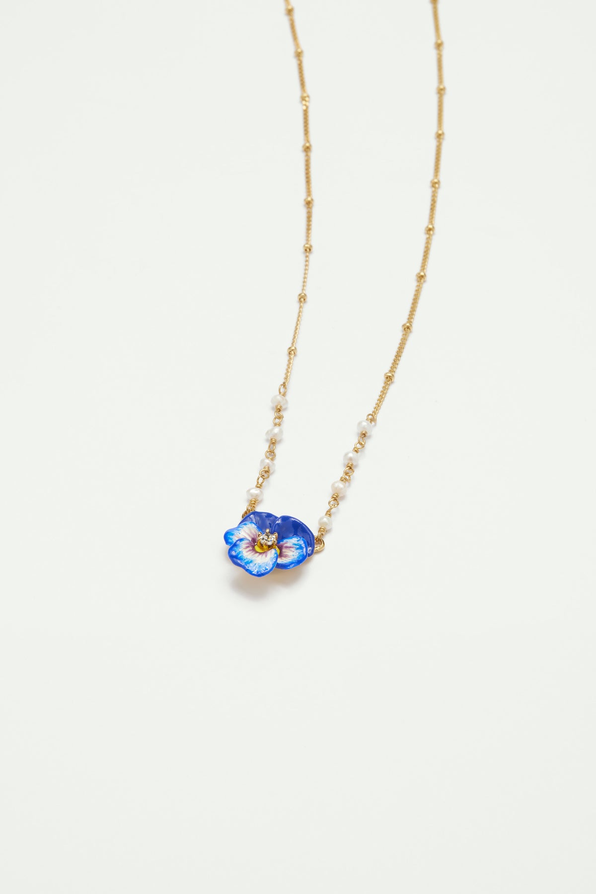 Blue pansy and faceted crystal pendant necklace