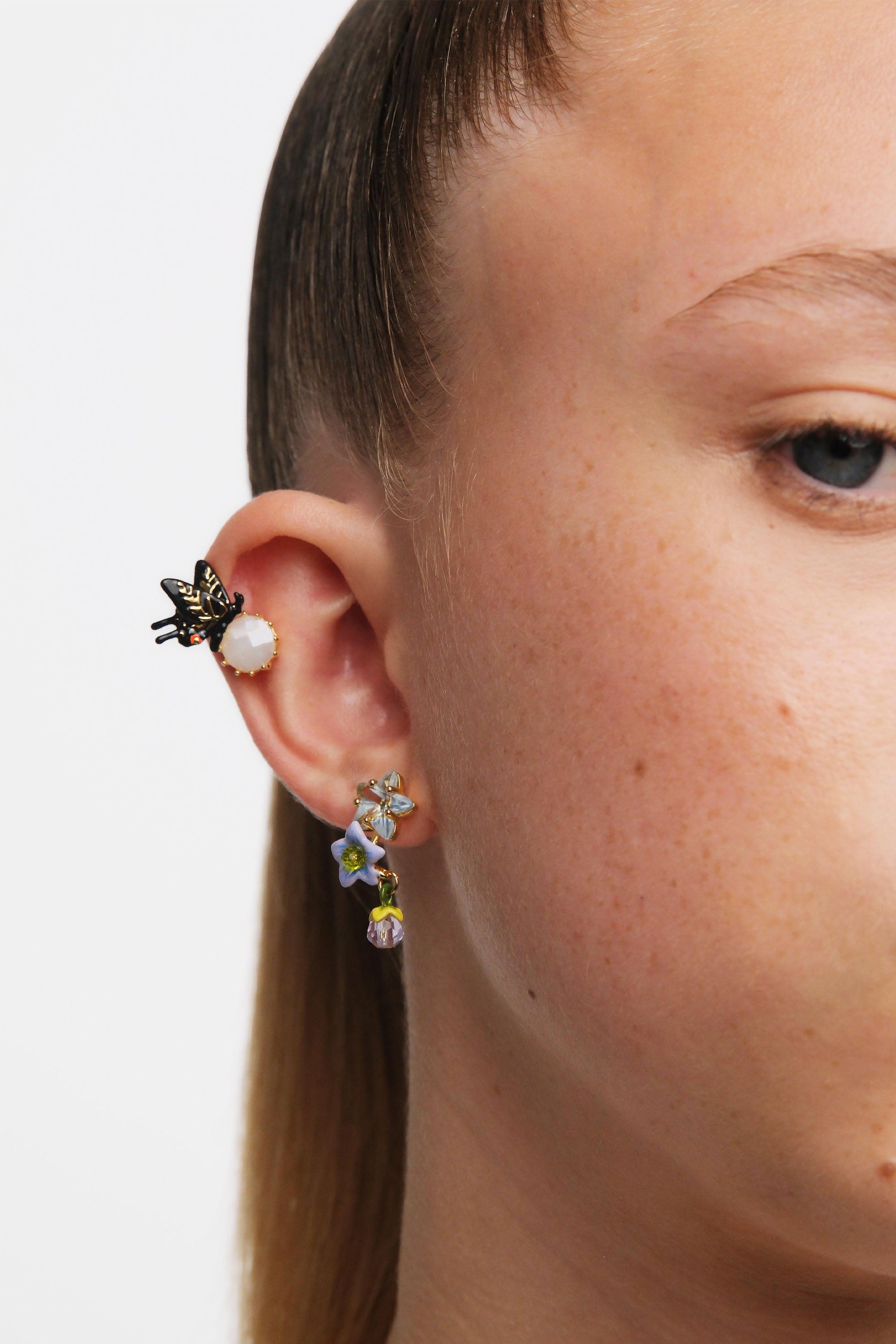 Asymmetrical faceted star and jasmine flower Post earrings