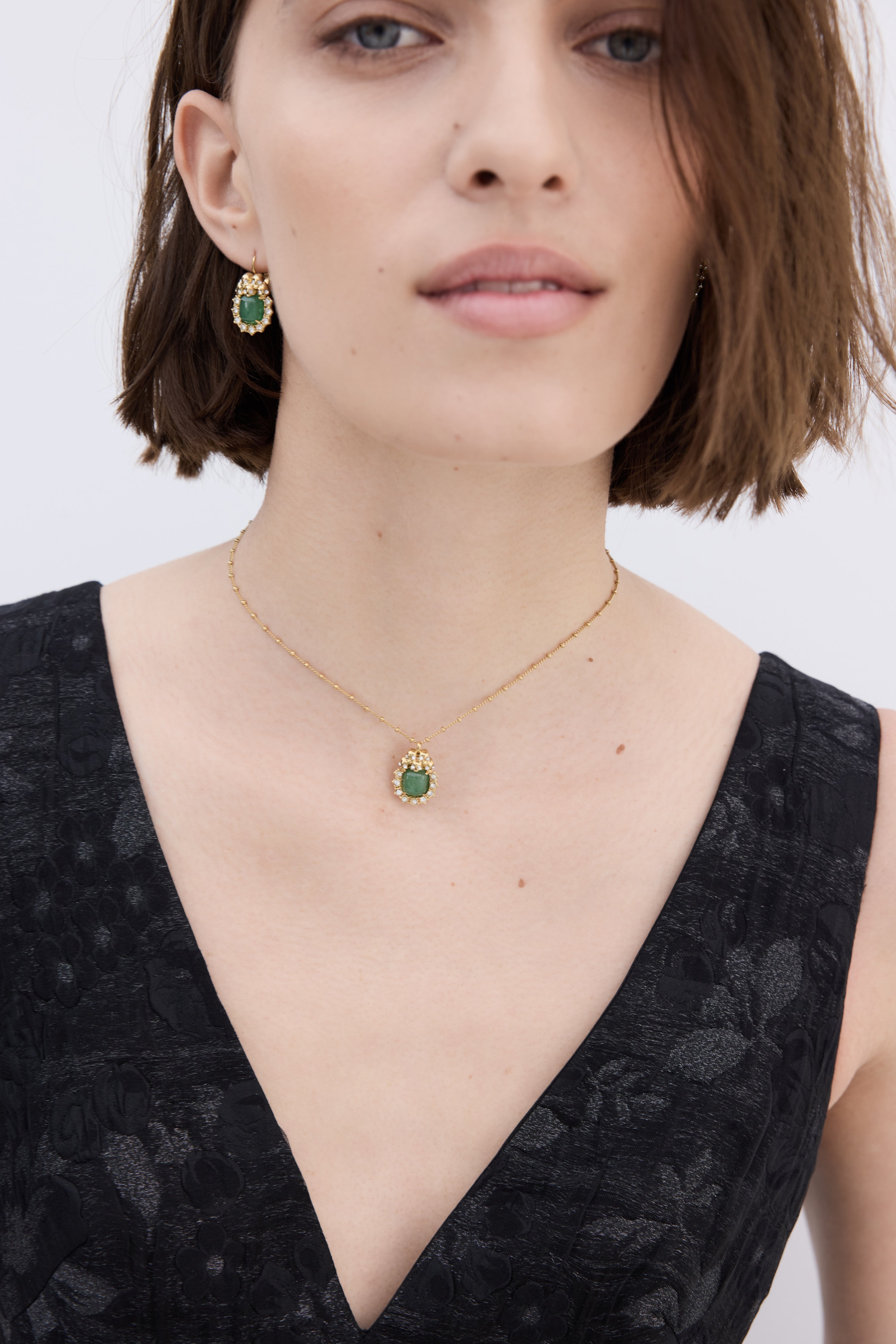 Green aventurine, skulls and crystal pendant necklace