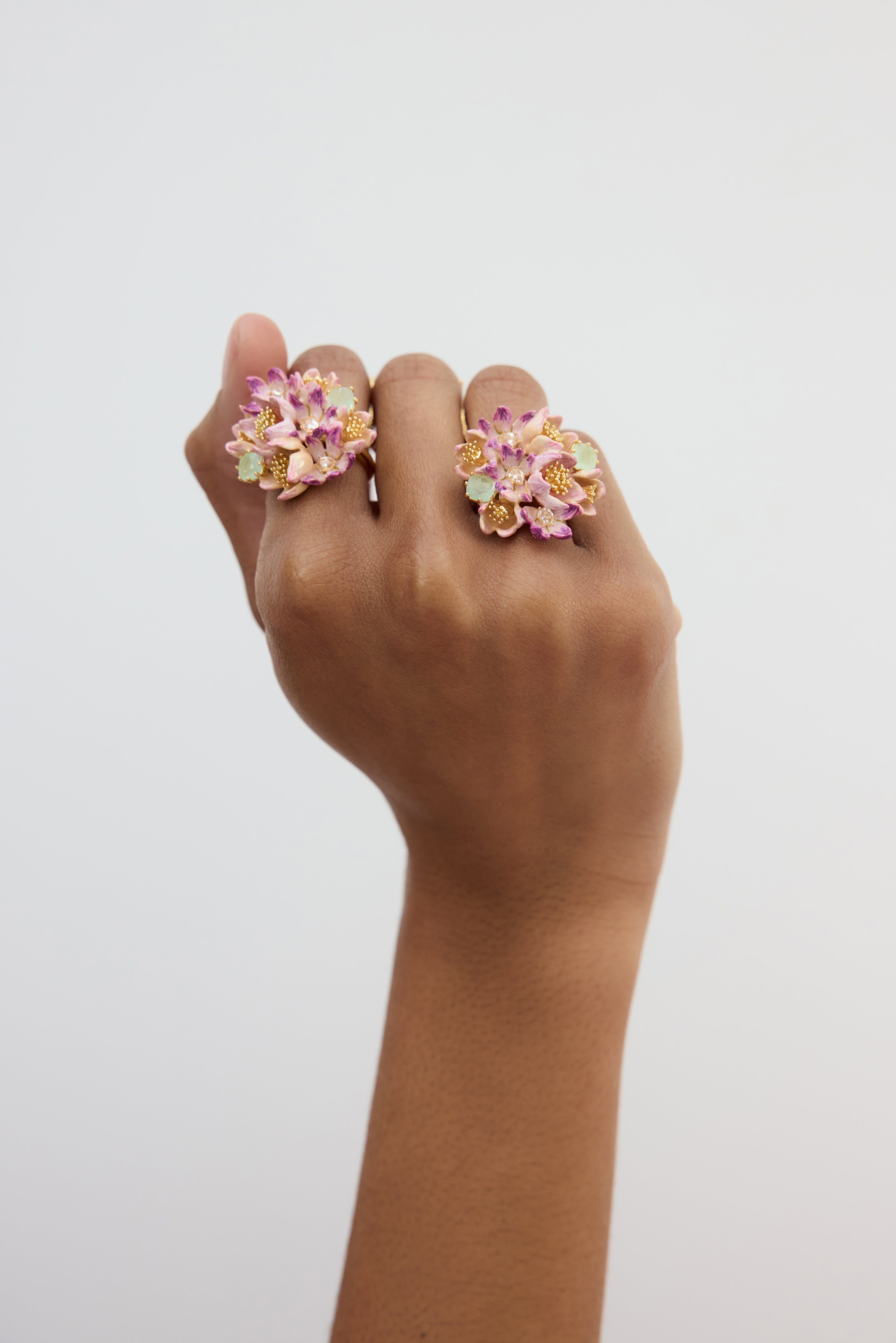 Bouquet of pink hellebores and green stone ring