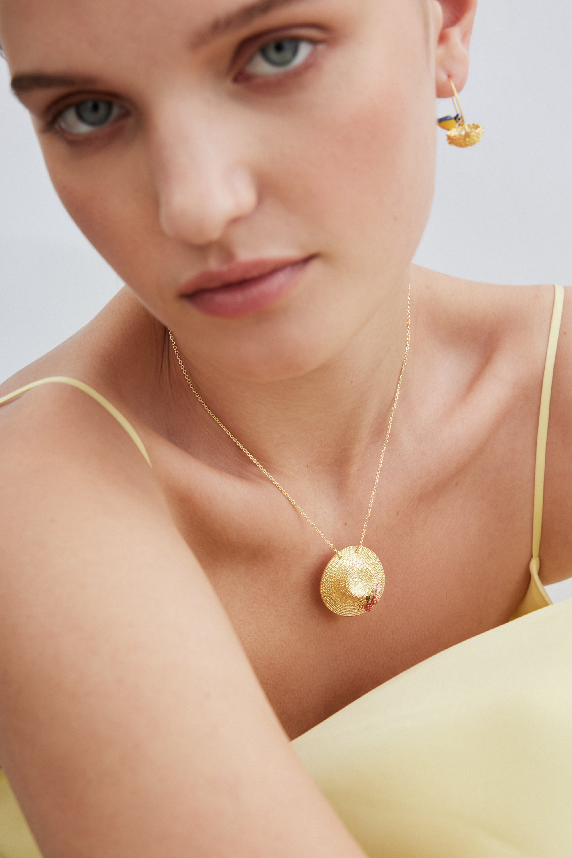 Pendant necklace with gold hat, cosmos, bee, raspberry and pink crystal