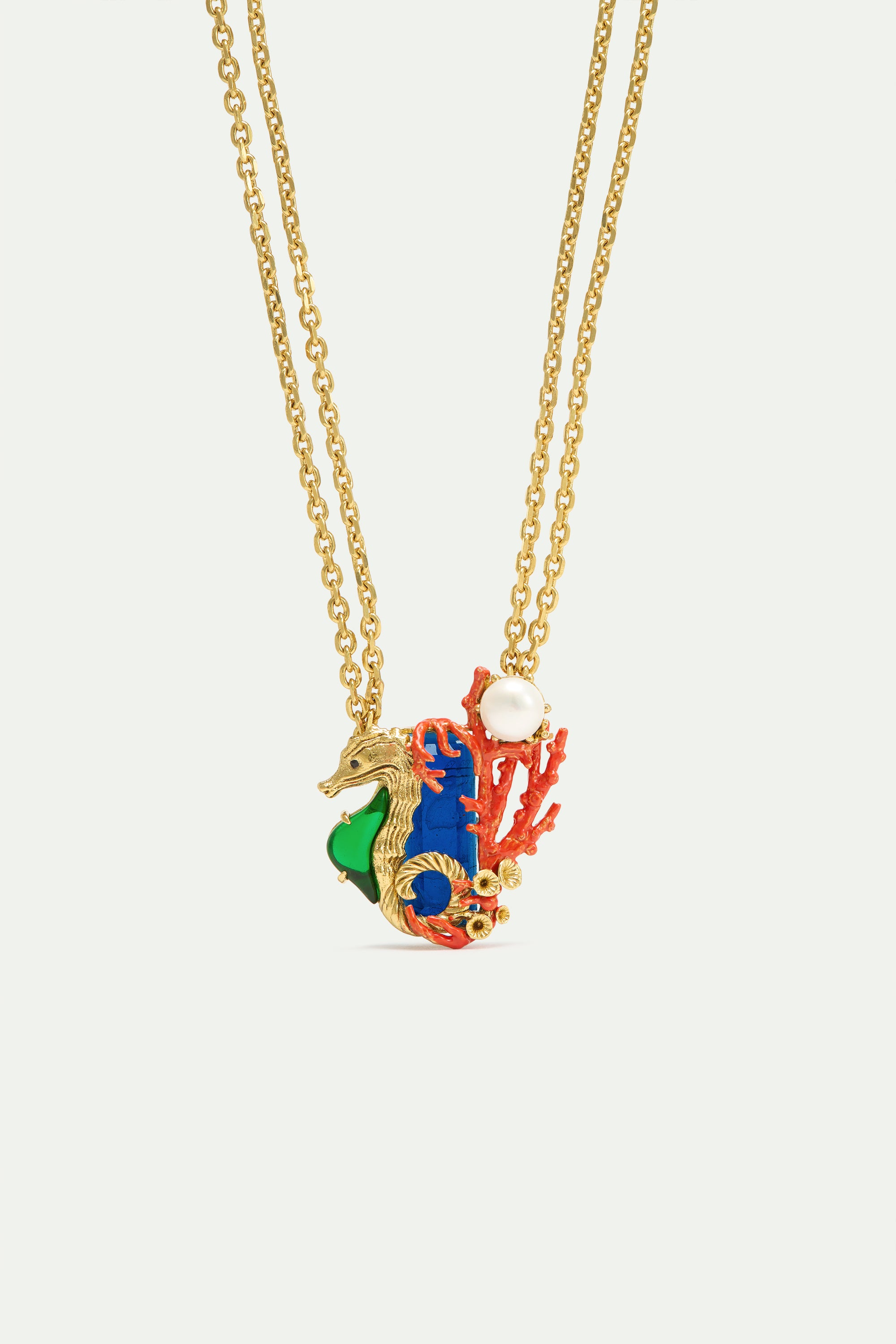 Navy blue stone necklace with green and golden seahorse