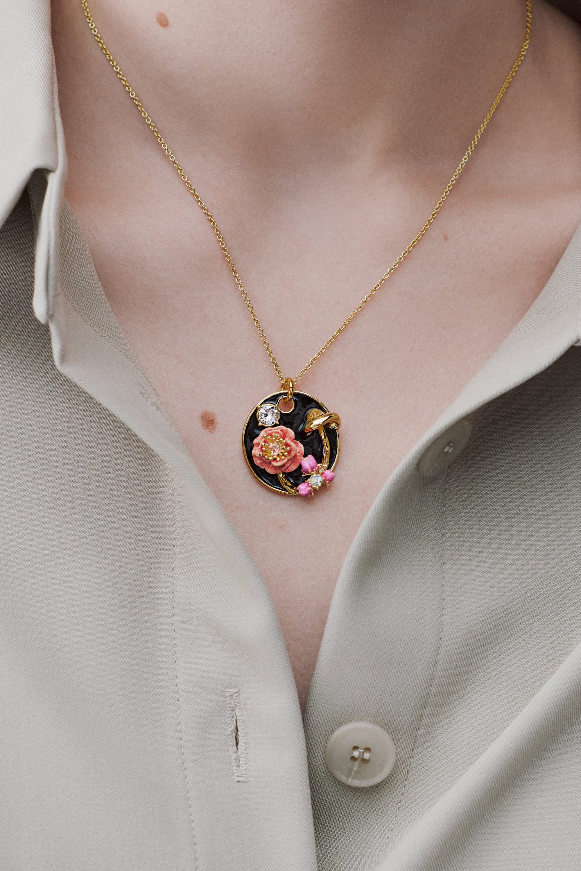 Black medallion pendant necklace with mushroom, anemone and crystals