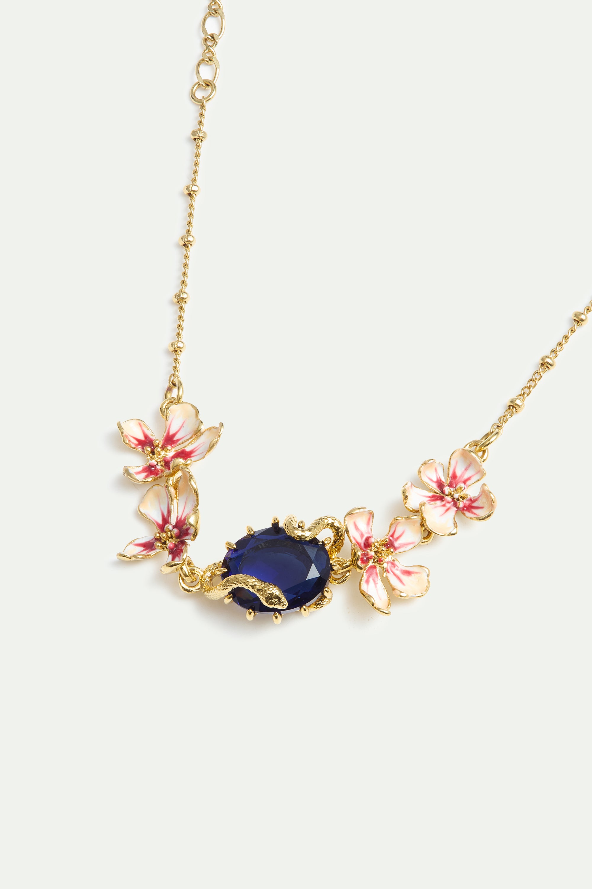 Bracelet with blue faceted stone, gold snake and mallow flowers