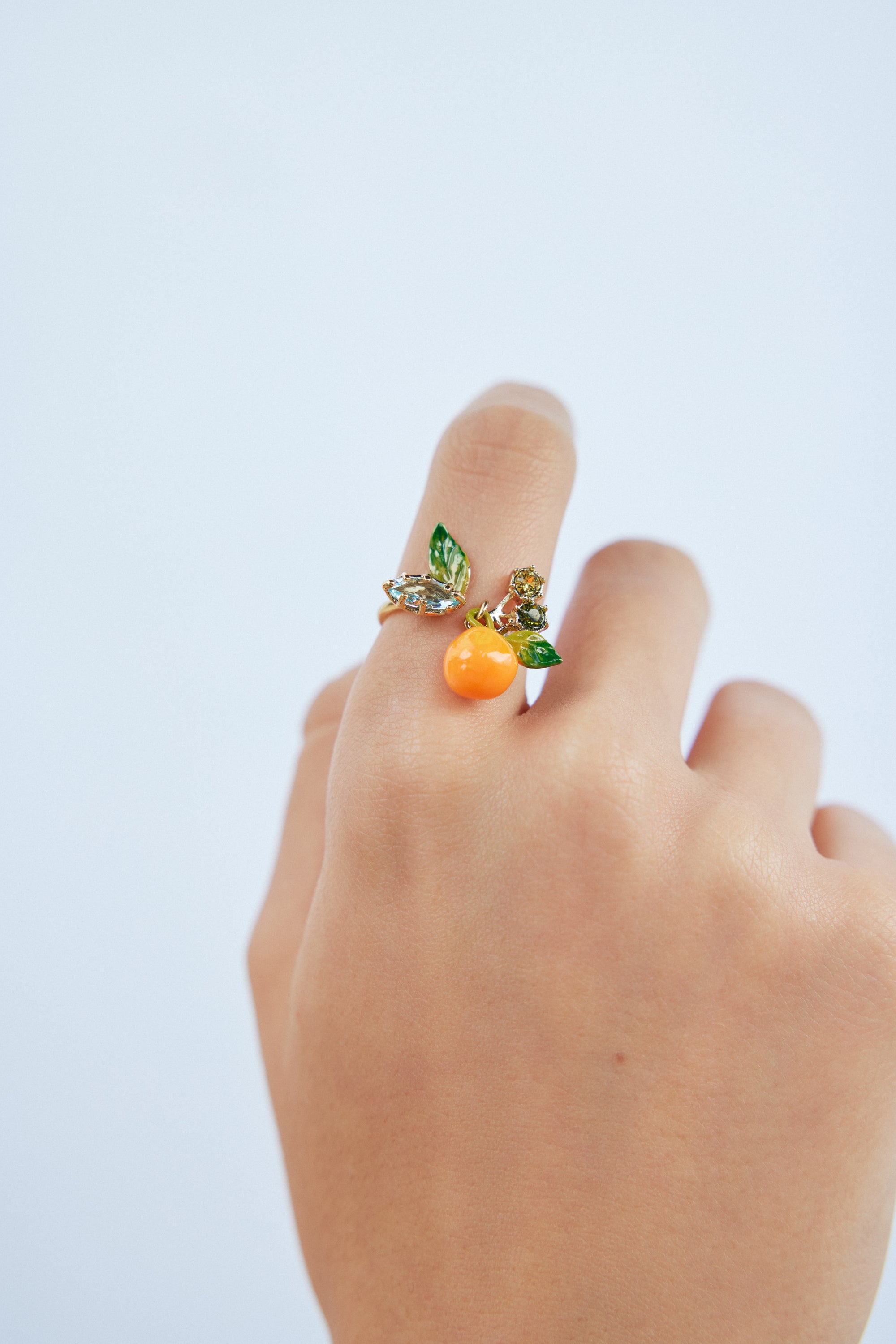 Orange adjustable ring with blue and green stones