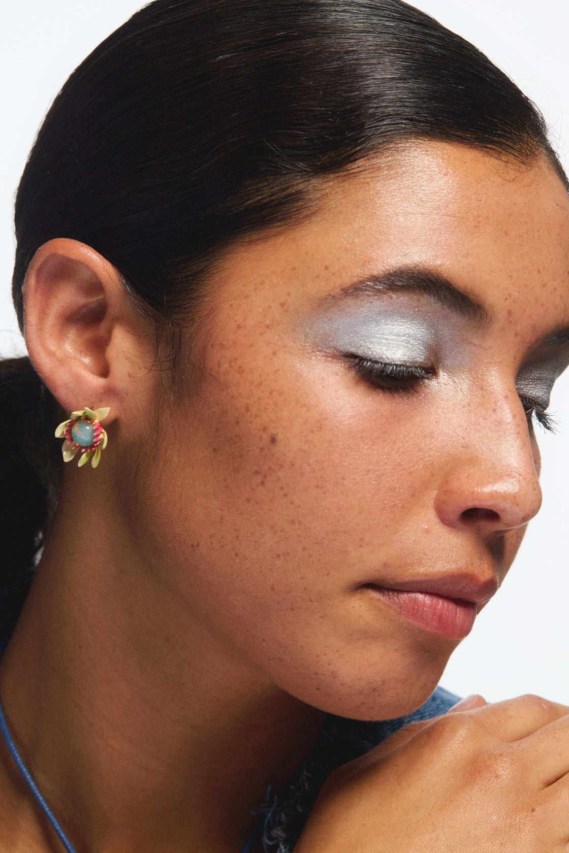 Large magnolia flower and blue cabochon earrings