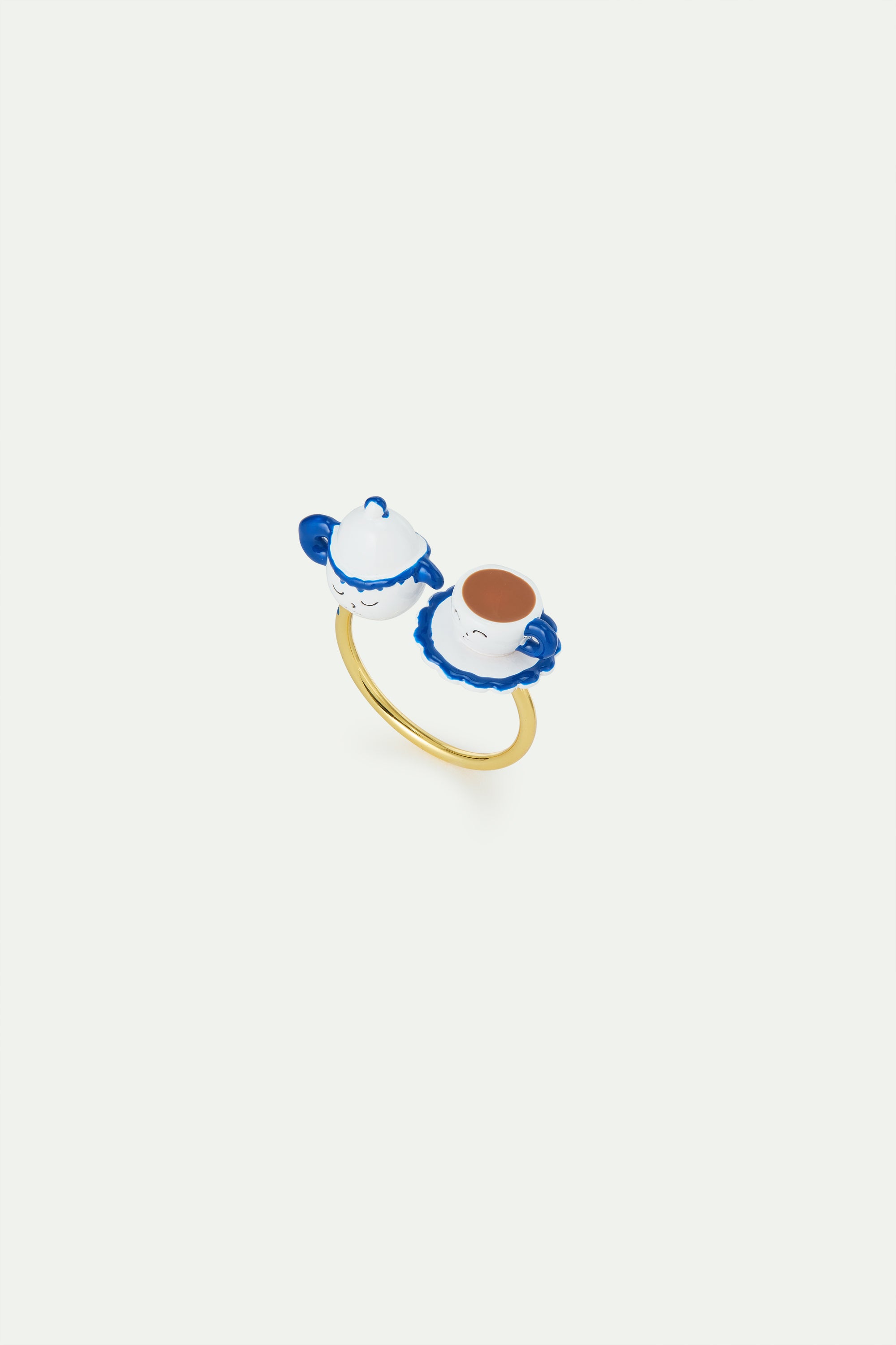Adjustable ring with blue and white teapot and yellow rhinestone