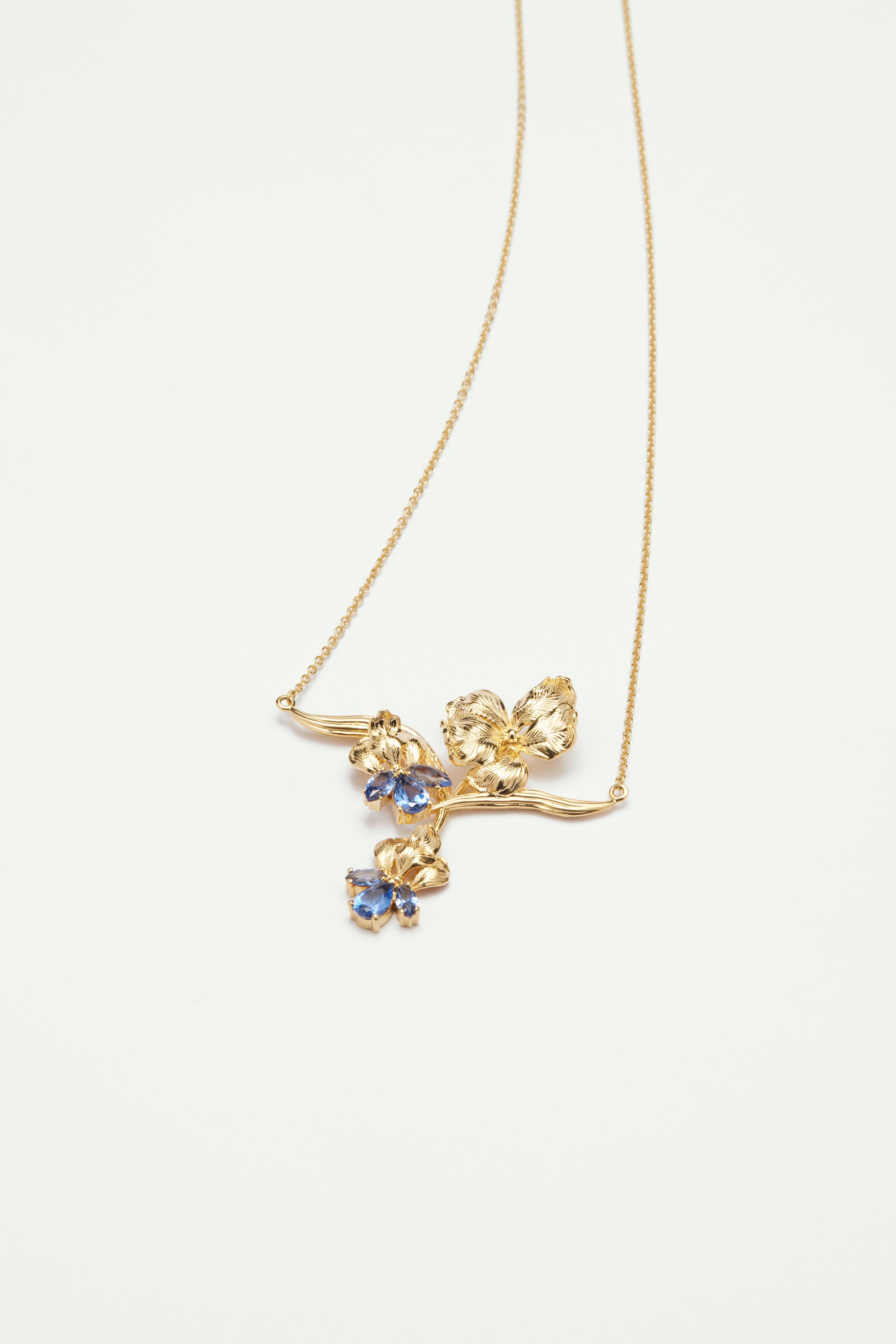 Gold iris and blue crystal statement necklace