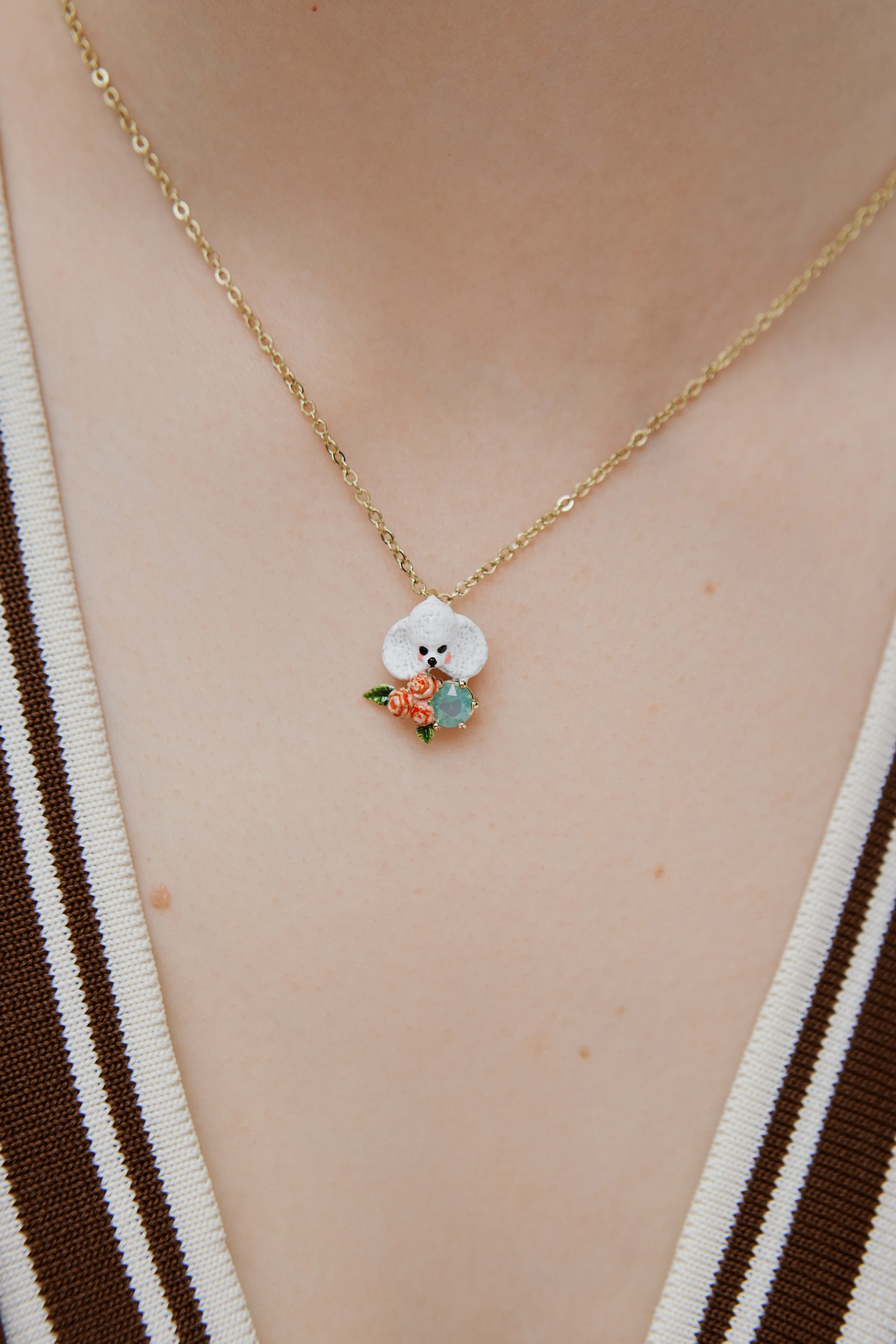 Poodle pendant necklace with pink roses and a blue stone