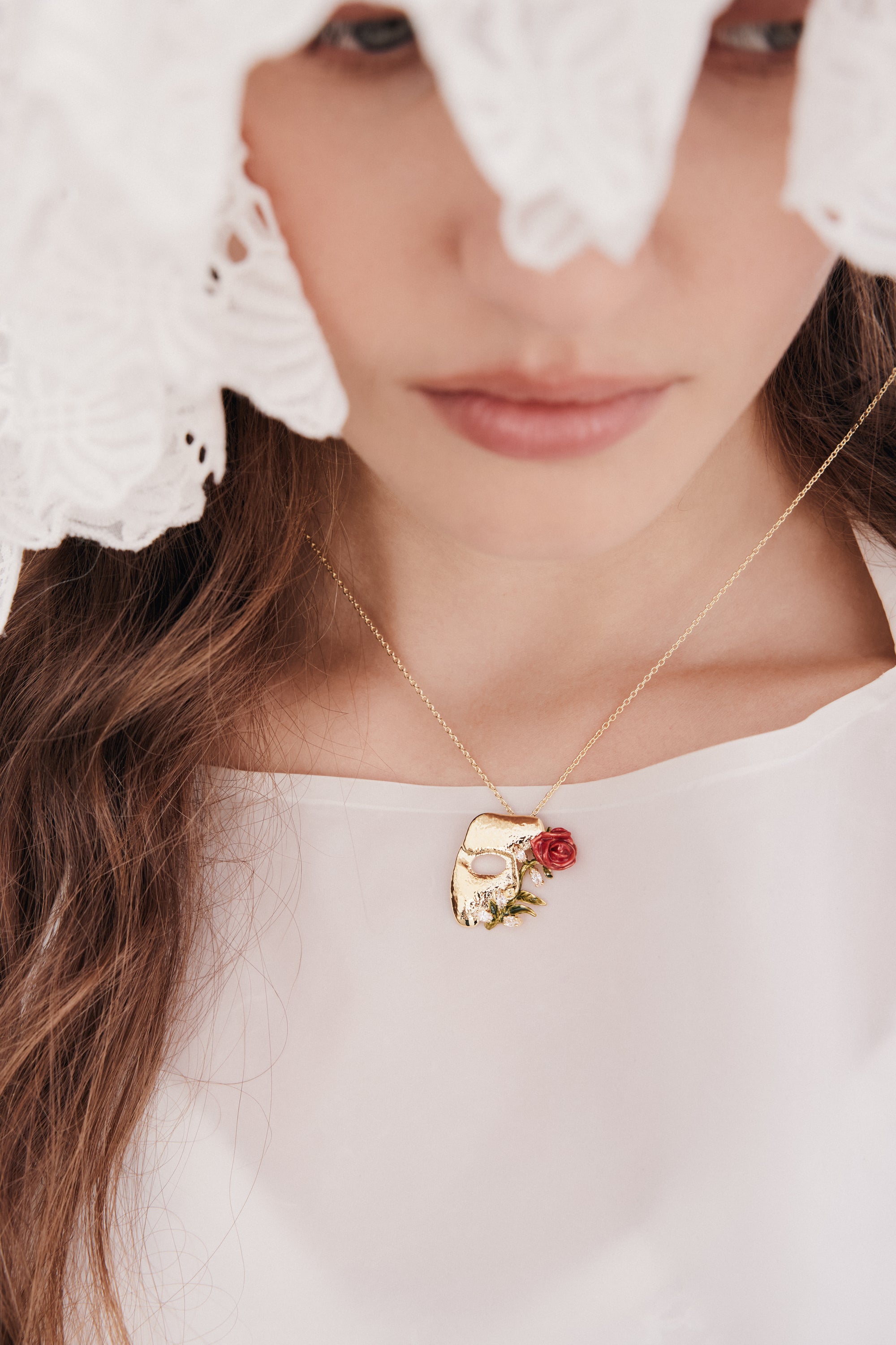 Gold mask, rose and crystal pendant necklace