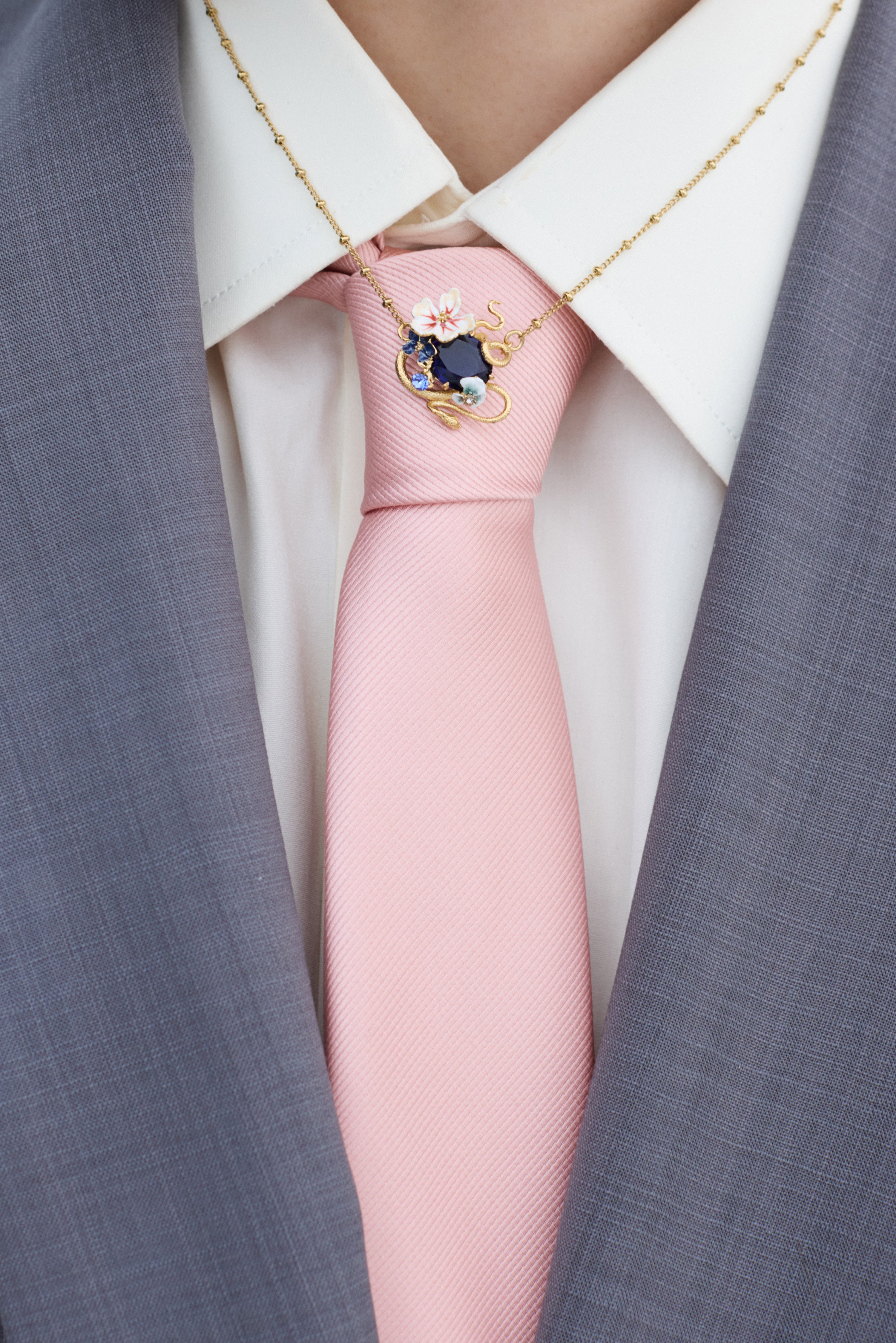 Necklace with blue faceted stone, gold snake and mallow flowers