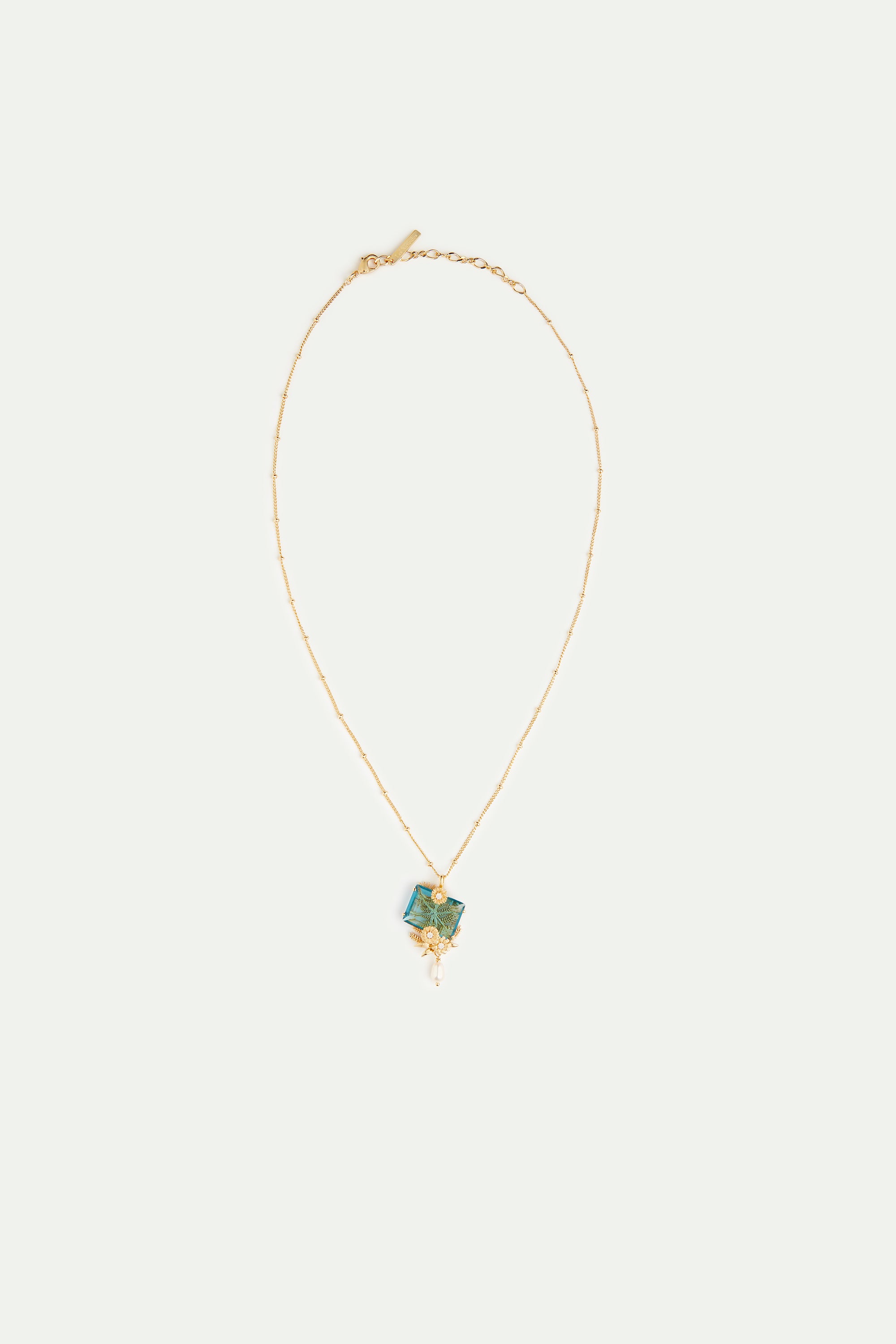 Blue cut stone, golden flowers and cultured pearl pendant necklace