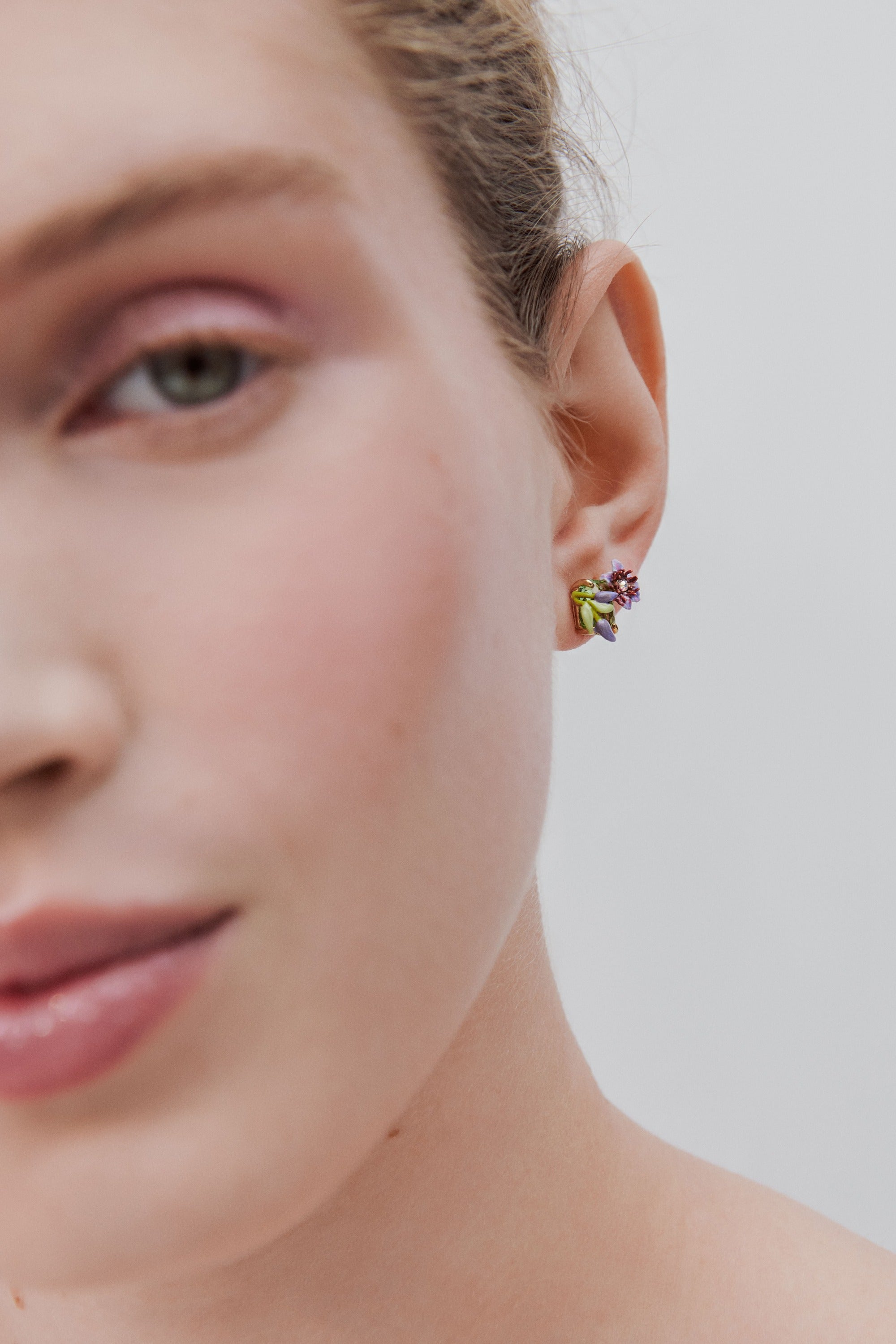 Purple clematis, ivy and emerald-cut faceted green glass earrings