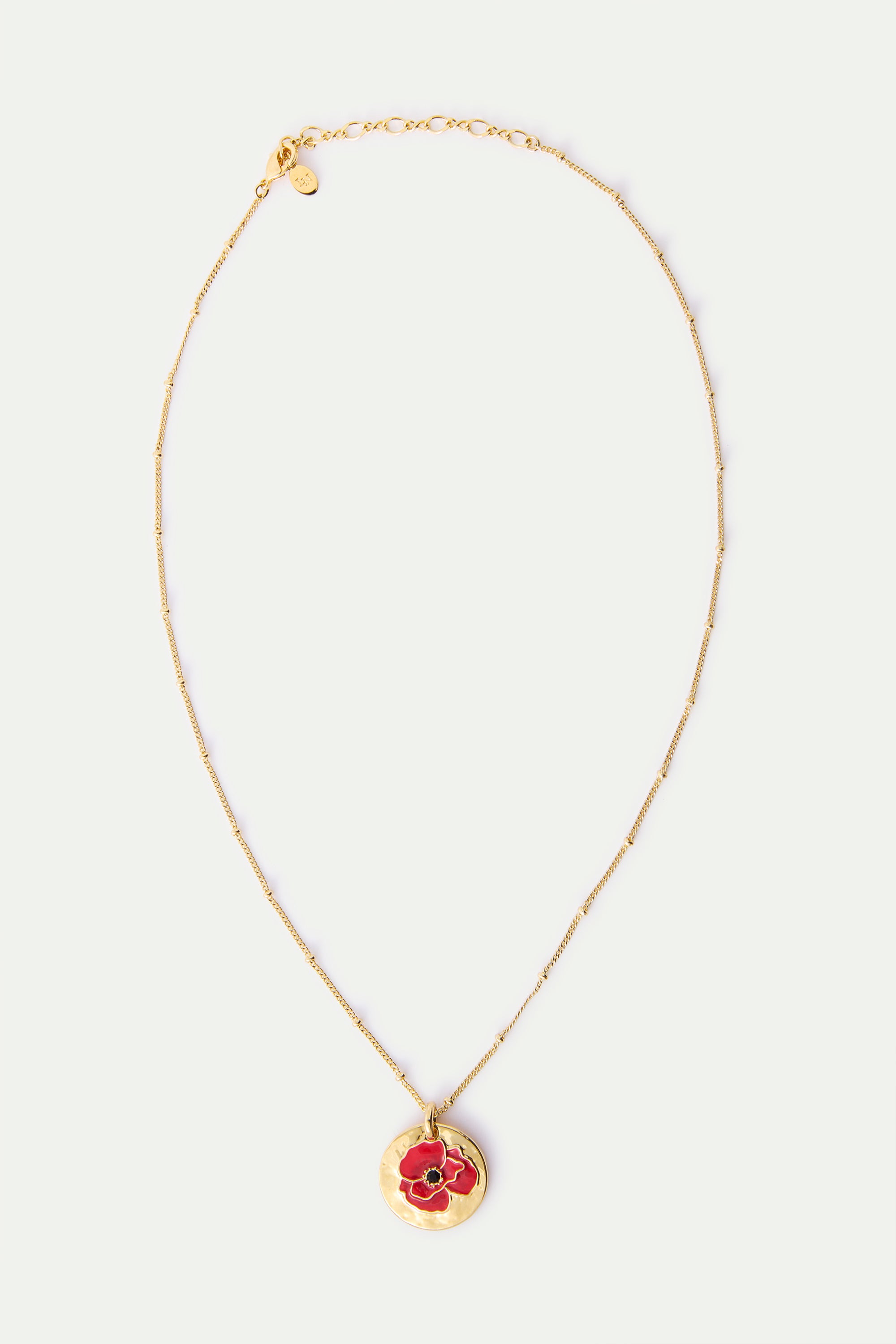 Pendant necklace with poppy on gold medallion