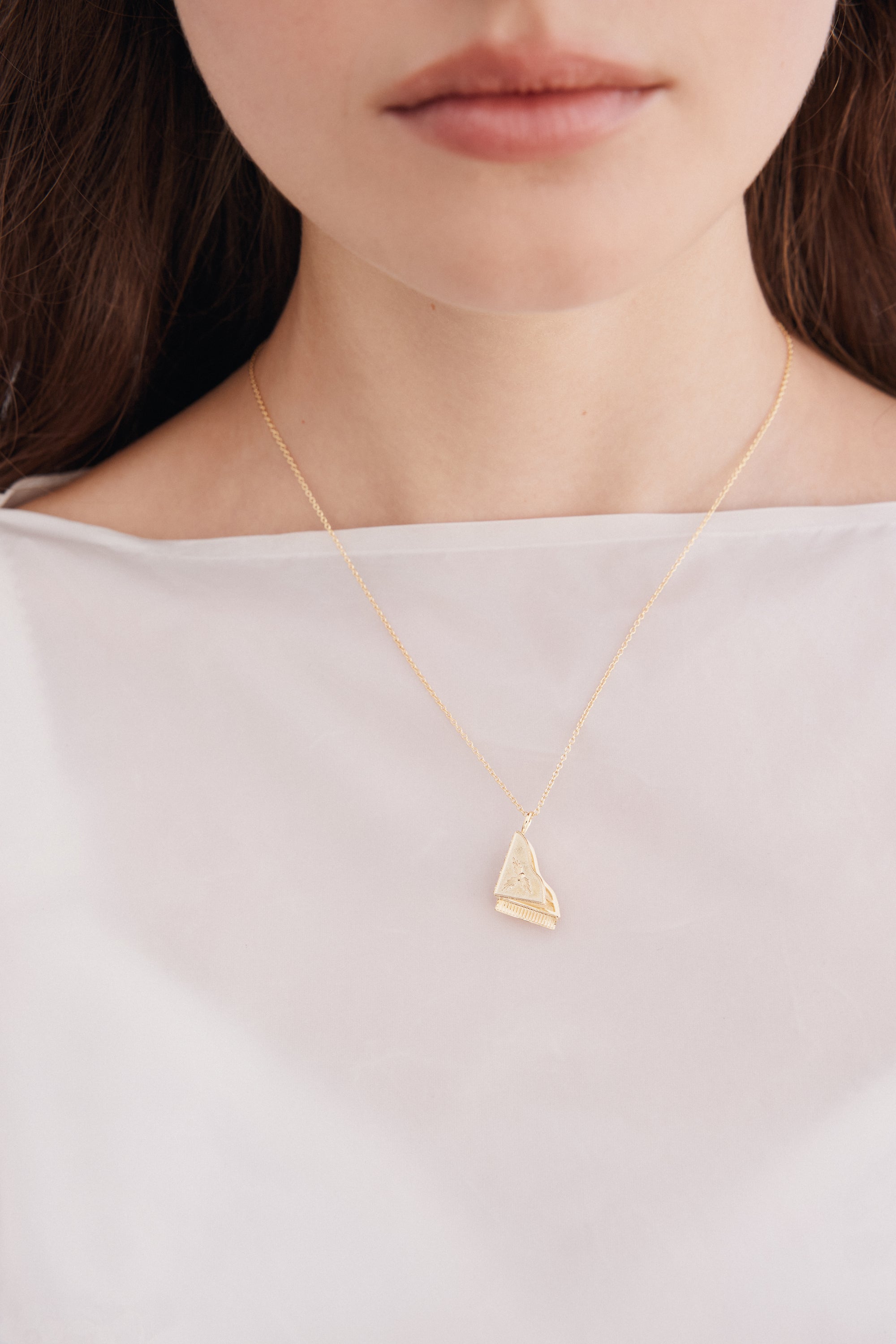 Gold piano pendant necklace