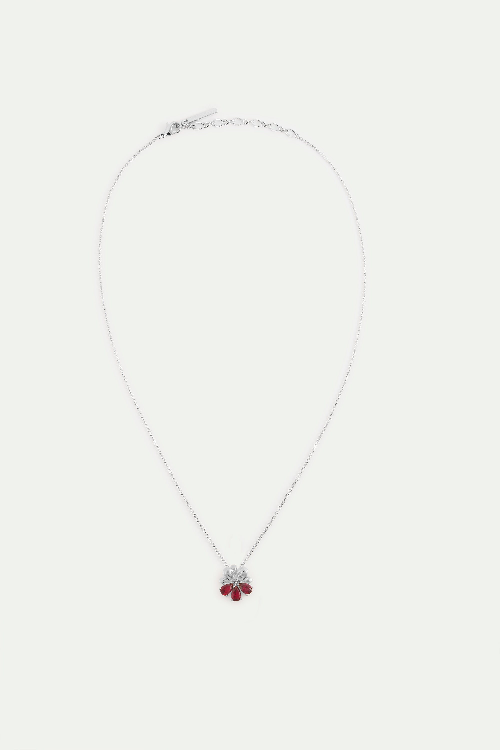 Silver pendant necklace with cosmos and red stones