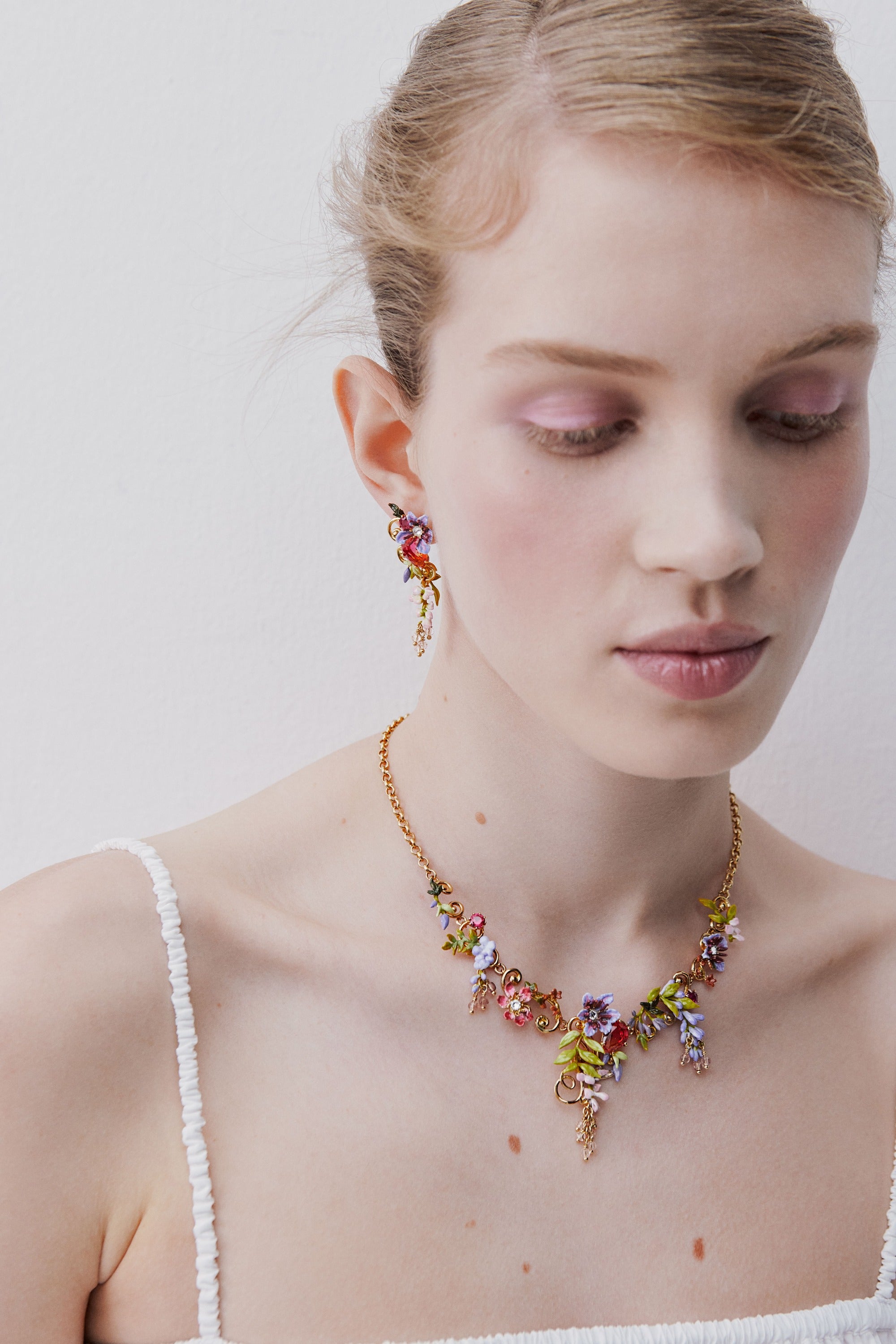 Two-tone faceted glass dangle earrings, pink wisteria on a golden arabesque, faceted crystal bead and ivy