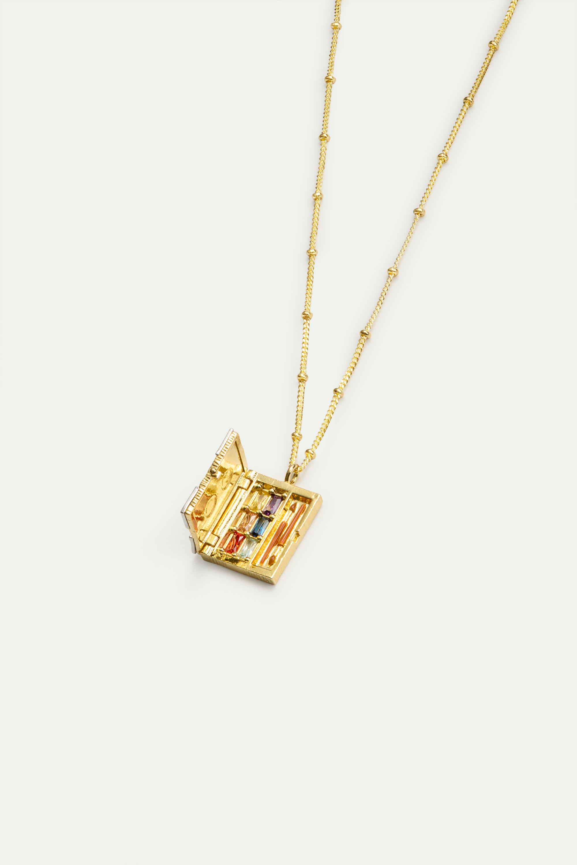 Golden art case pendant necklace