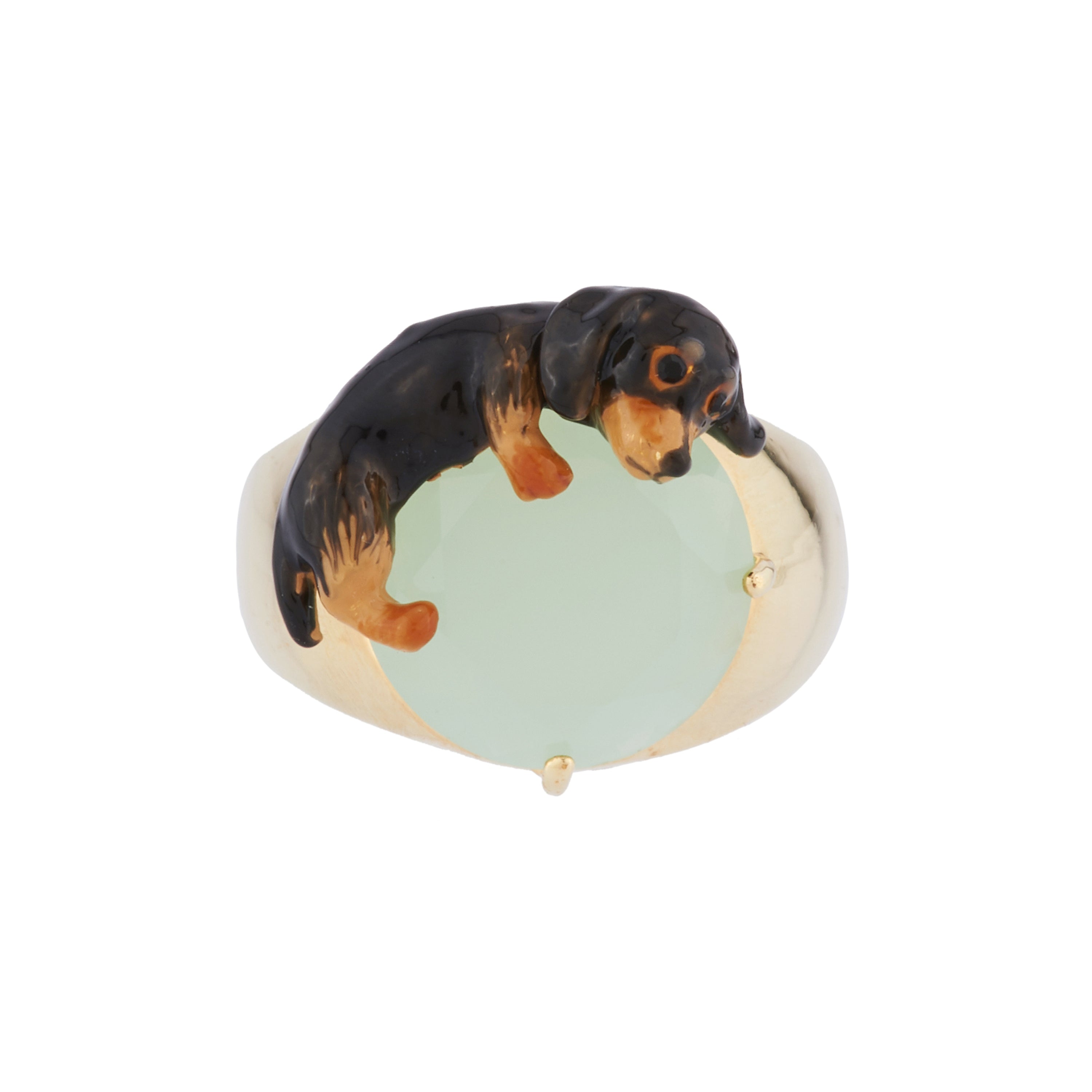 Ring with small dachshund lying on faceted crystal