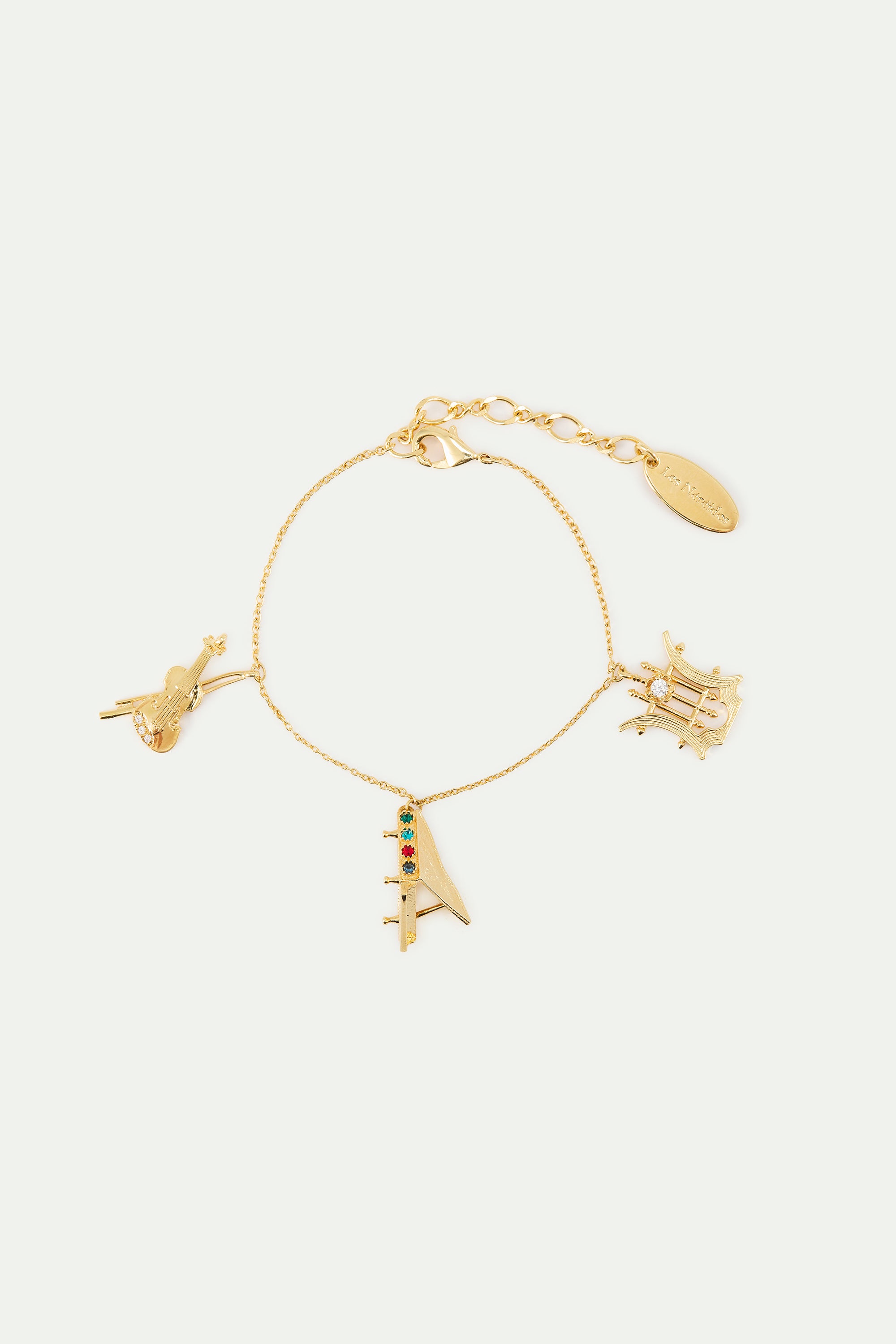 Gold musical instrument charm bracelet
