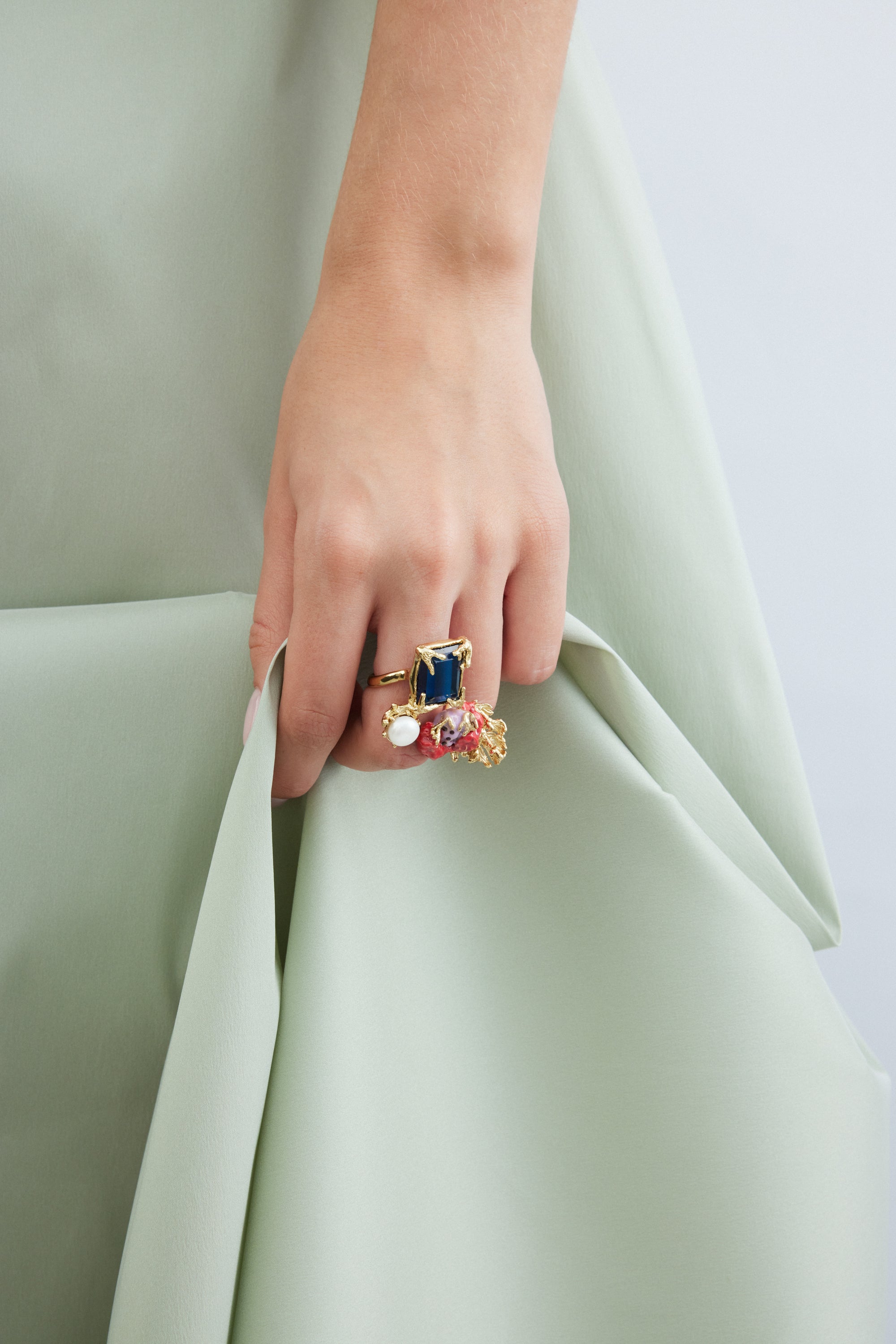 Adjustable gold ring with square blue stone, coral and pearl